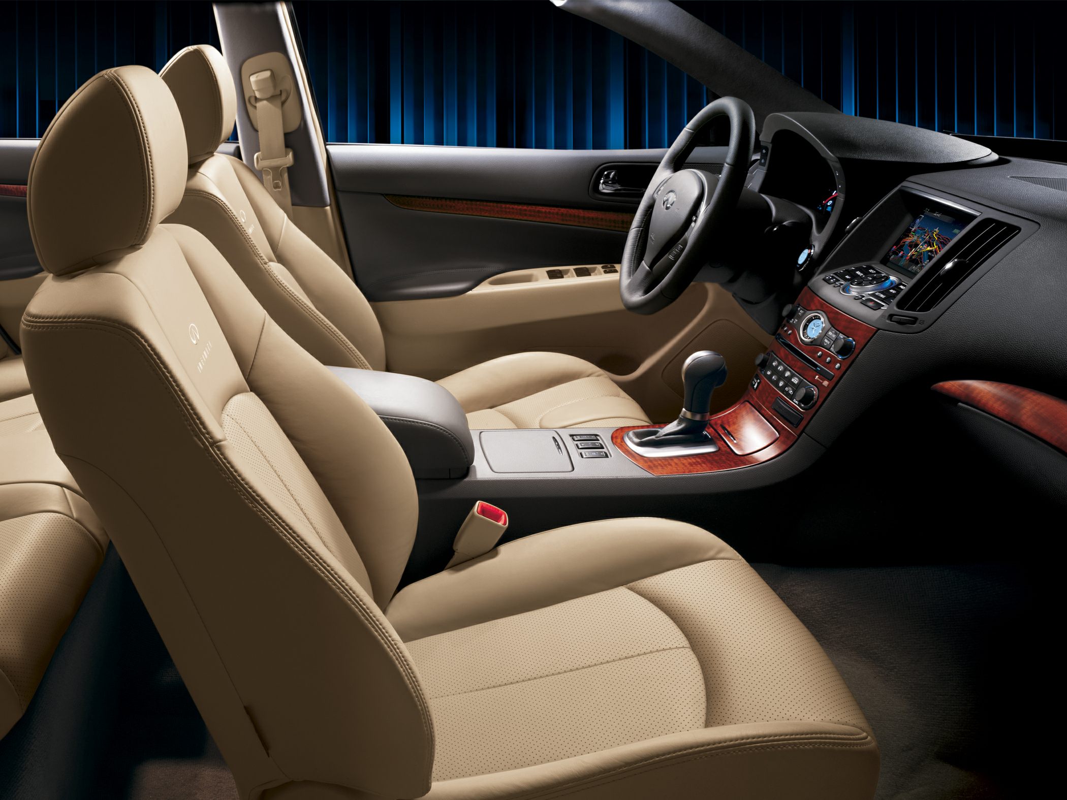 Beige leather front seats with wood trim dashboard and modern infotainment system