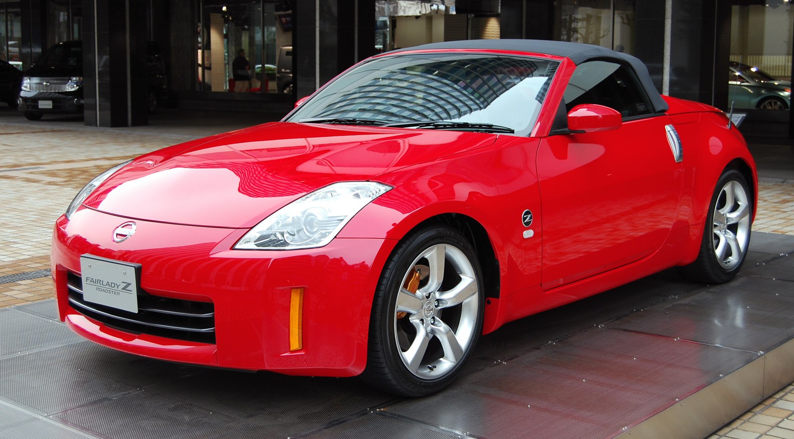 Red convertible with alloy wheels and sporty design