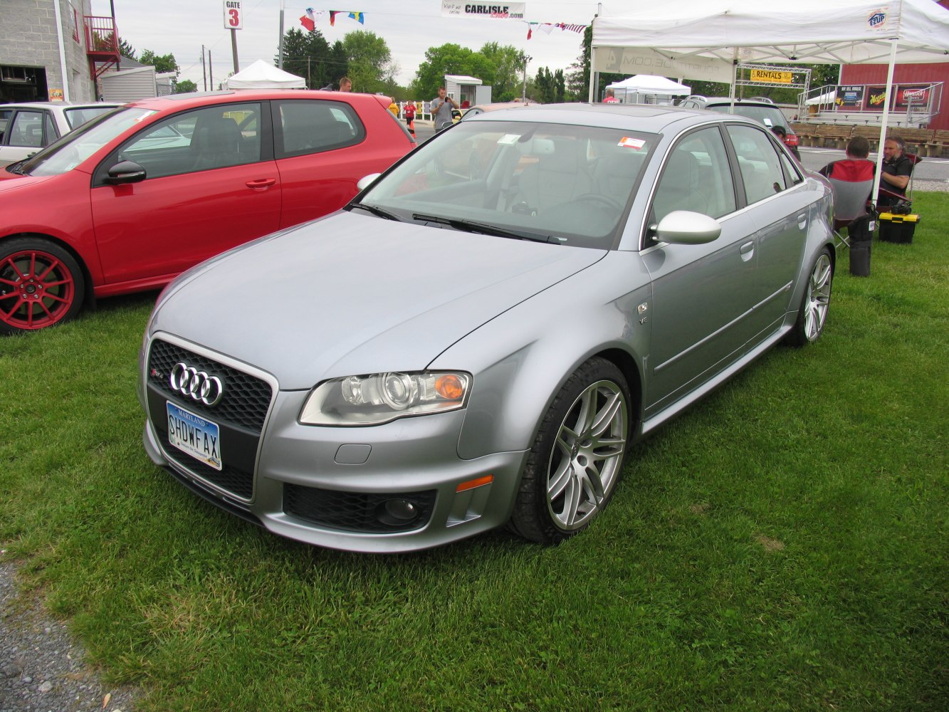 Silver sporty sedan with distinctive front grille and alloy wheels.