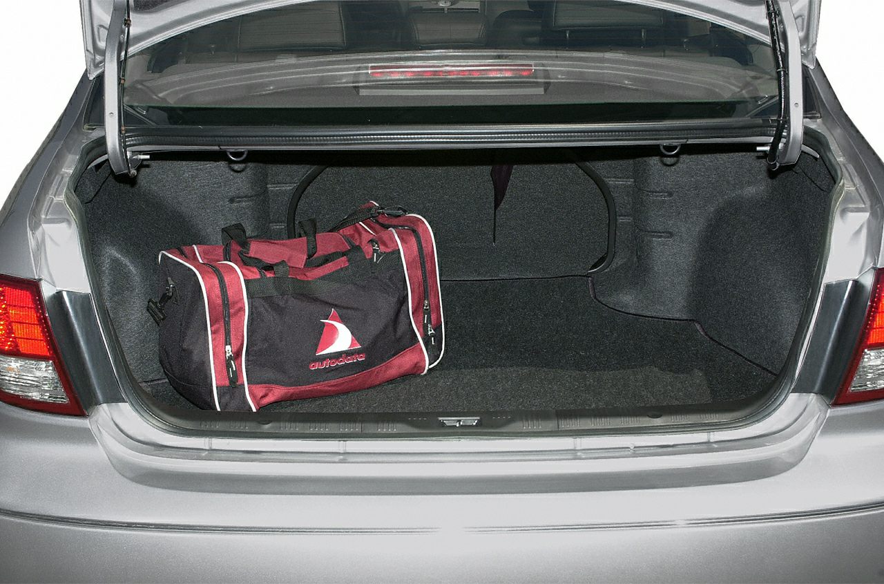 Spacious car trunk with a sports bag inside