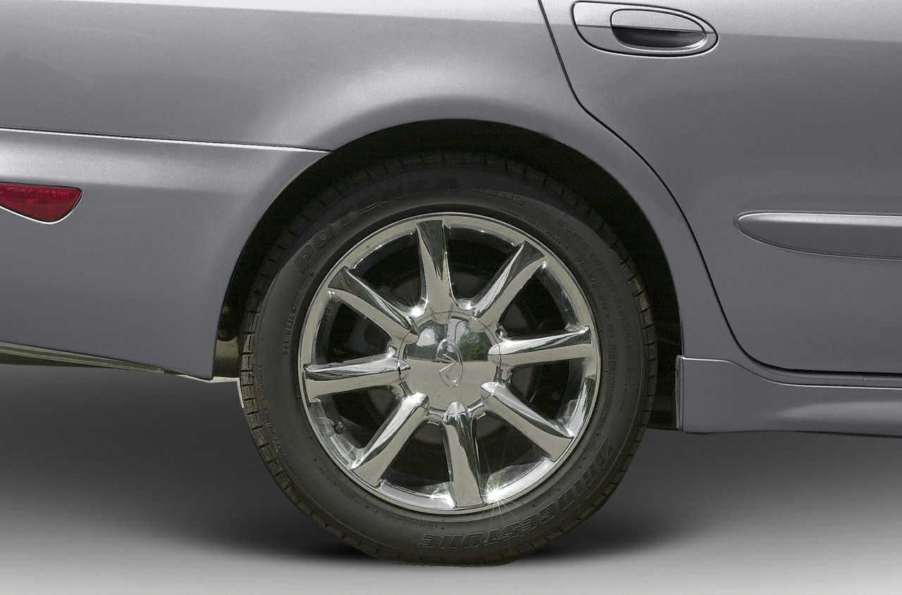 Chrome alloy wheel and rear door handle detail