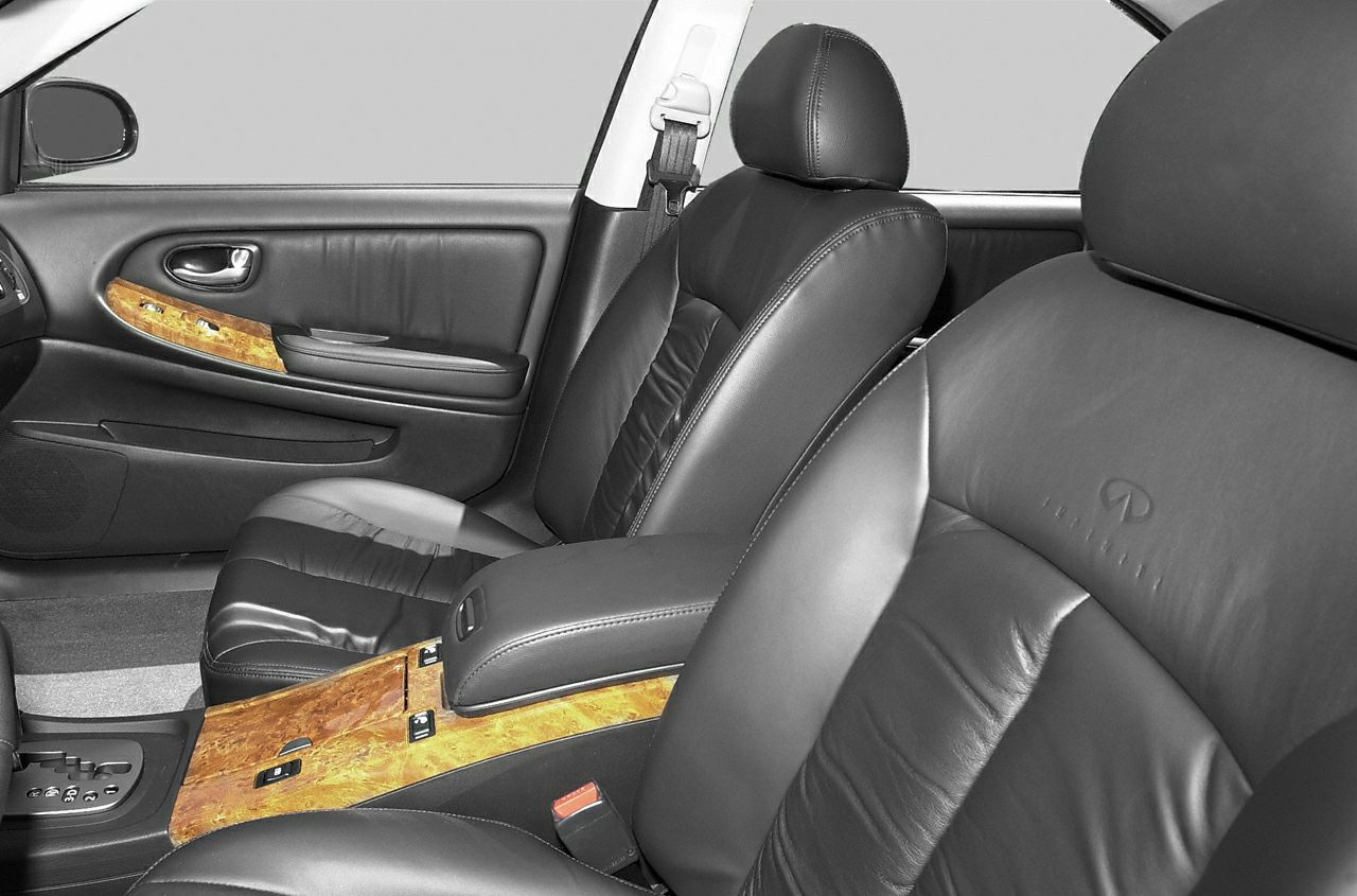 Luxury car interior with leather seats and wooden trim