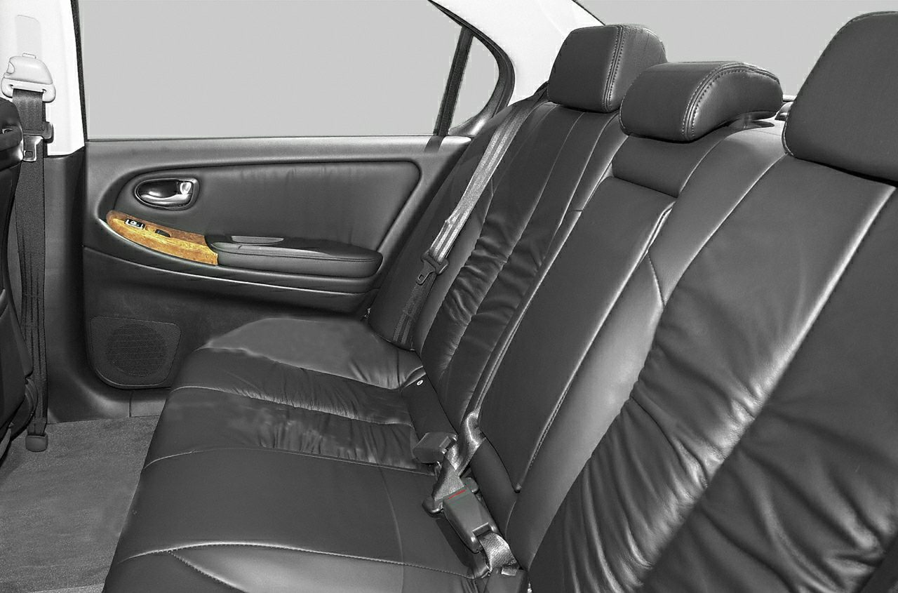 Leather rear seats with wood trim door panel and seatbelt features