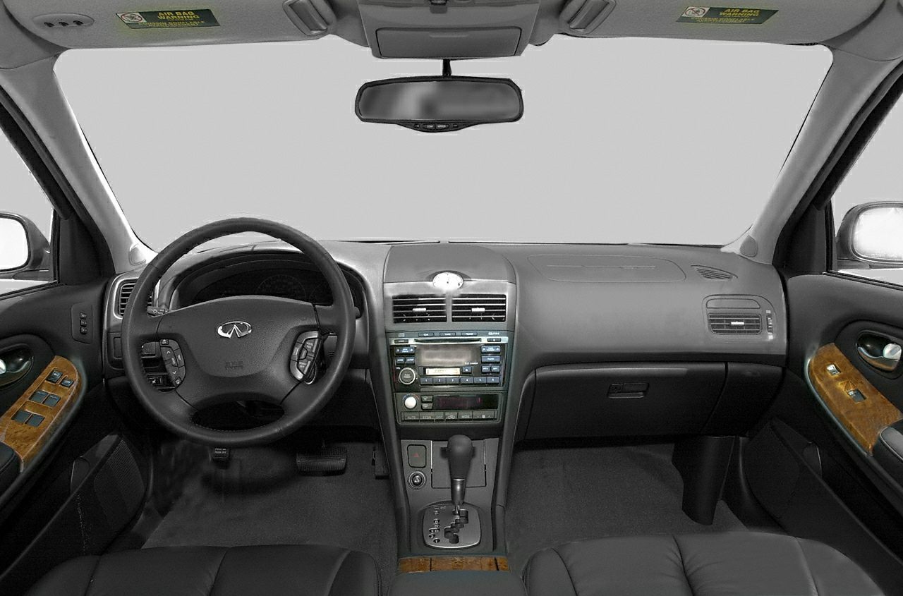 Dashboard and multifunction steering wheel with wood trim and leather seats
