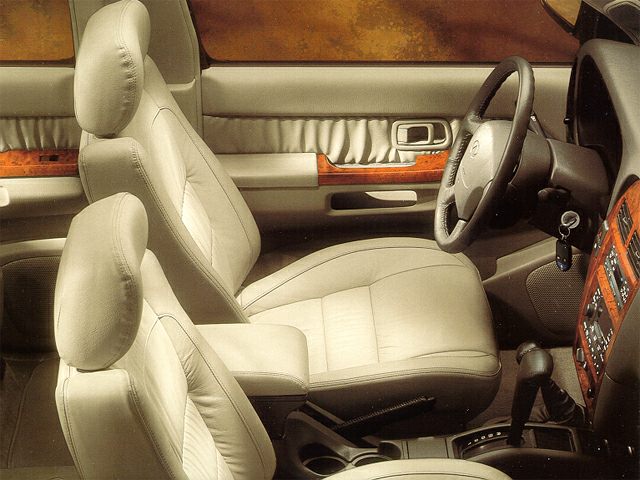 Leather seats with wood trim and dashboard controls