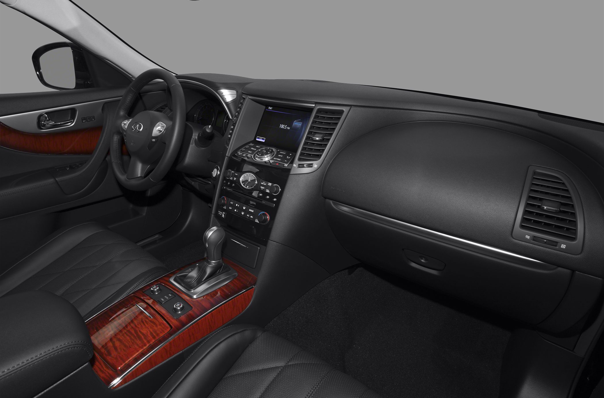 Luxurious interior cabin with wood trim and modern dashboard controls