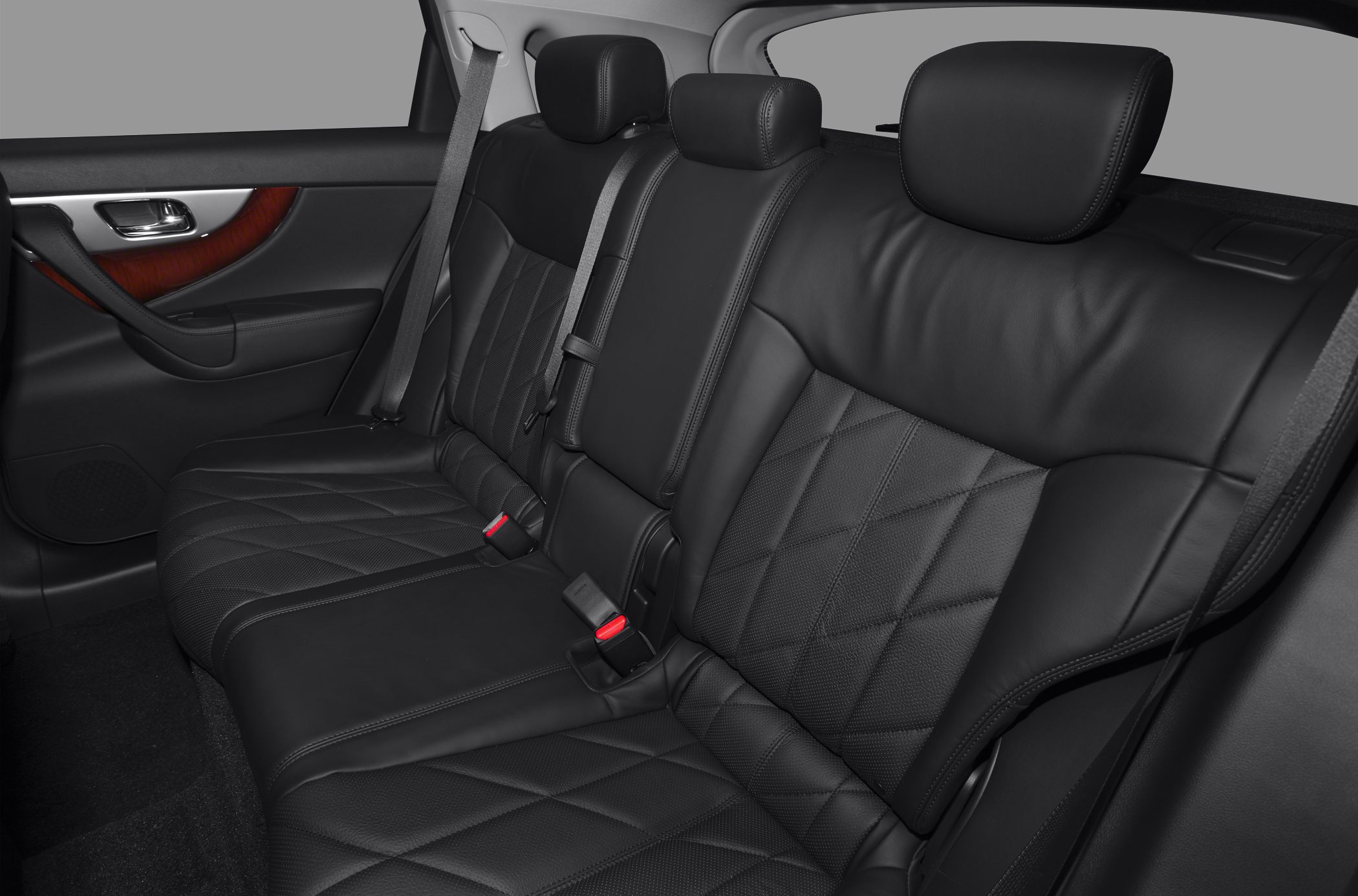 Rear black leather seats with diamond stitching and adjustable headrests