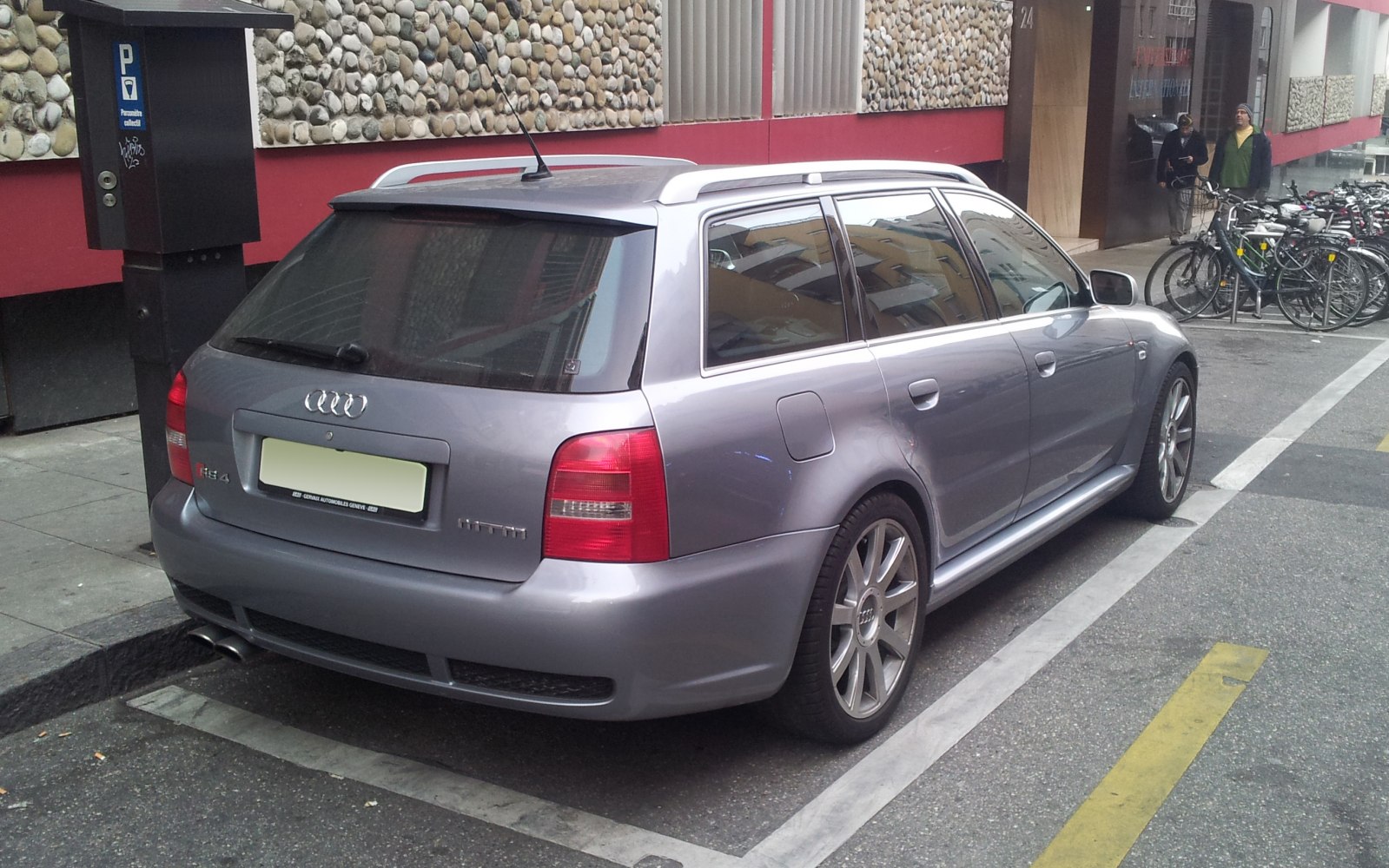 Rear and side view of estate car with roof rails and alloy wheels