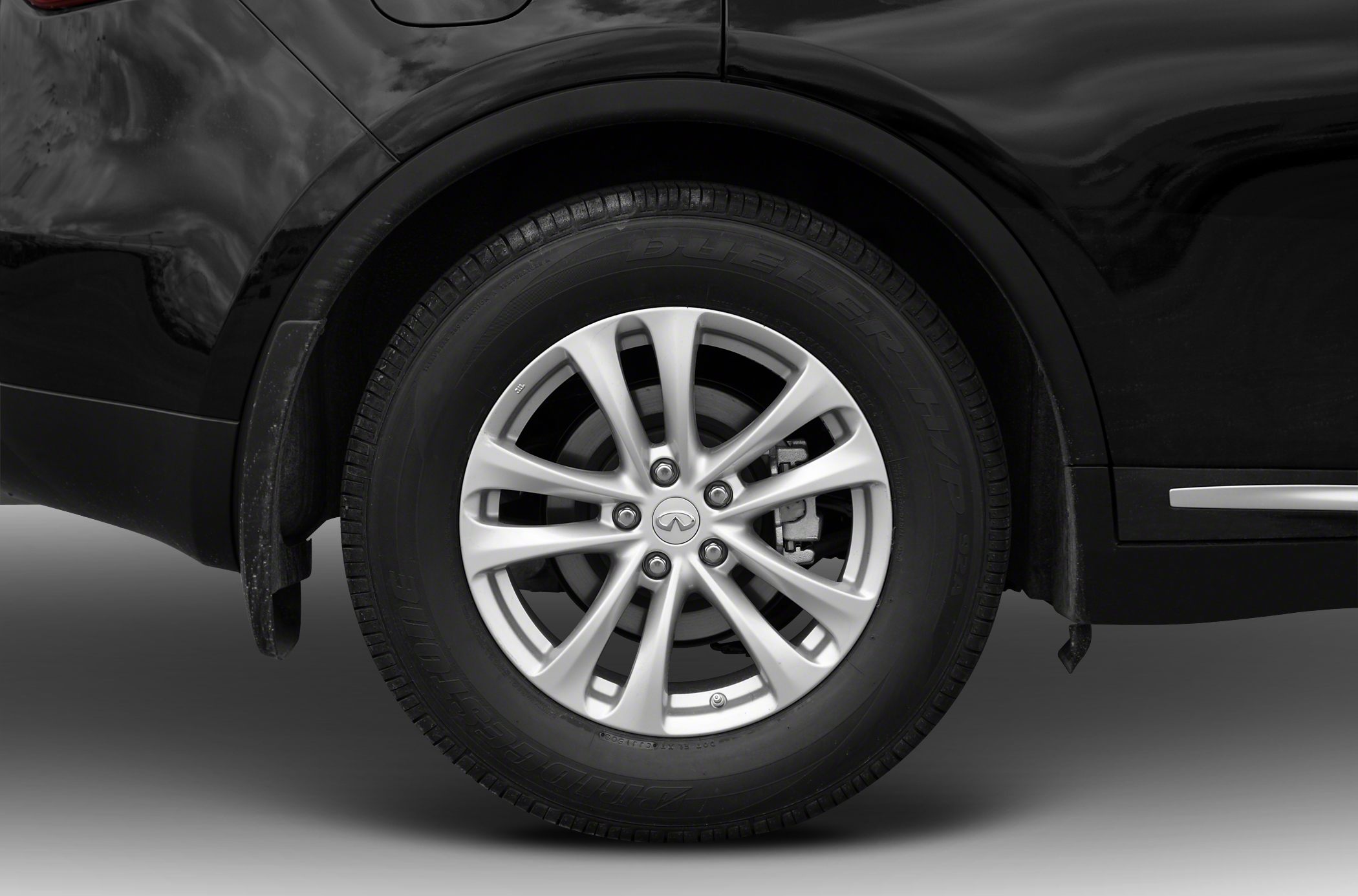 Close-up of alloy wheel and tire with brake disc visible