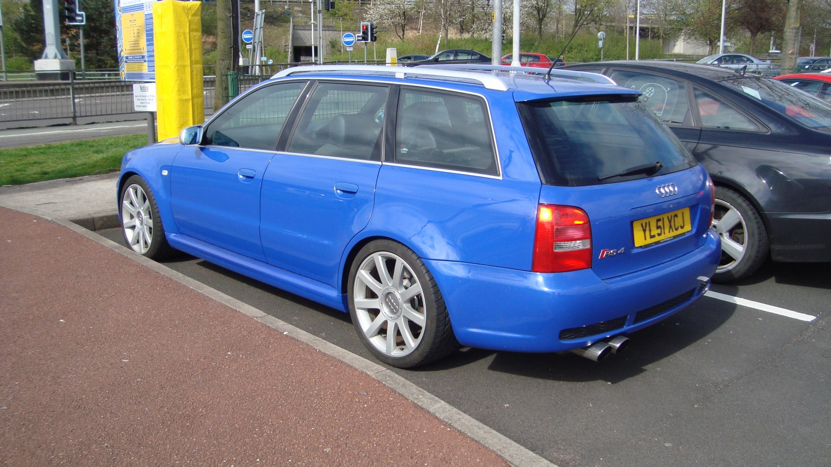 Blue wagon rear and side view with alloy wheels and tail lights