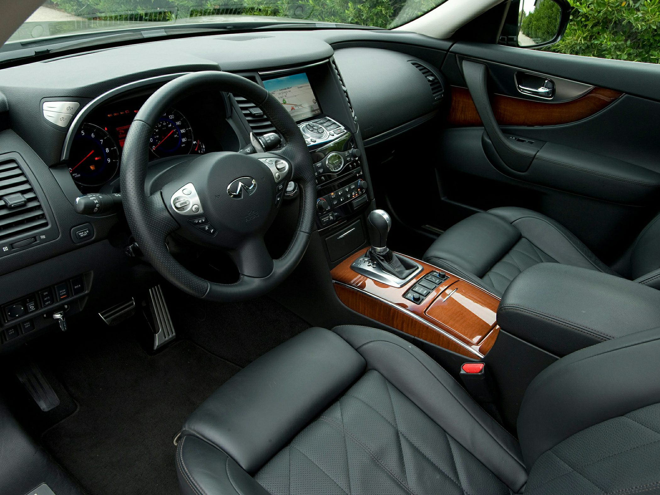 Leather seats, wooden center console, dashboard with infotainment screen