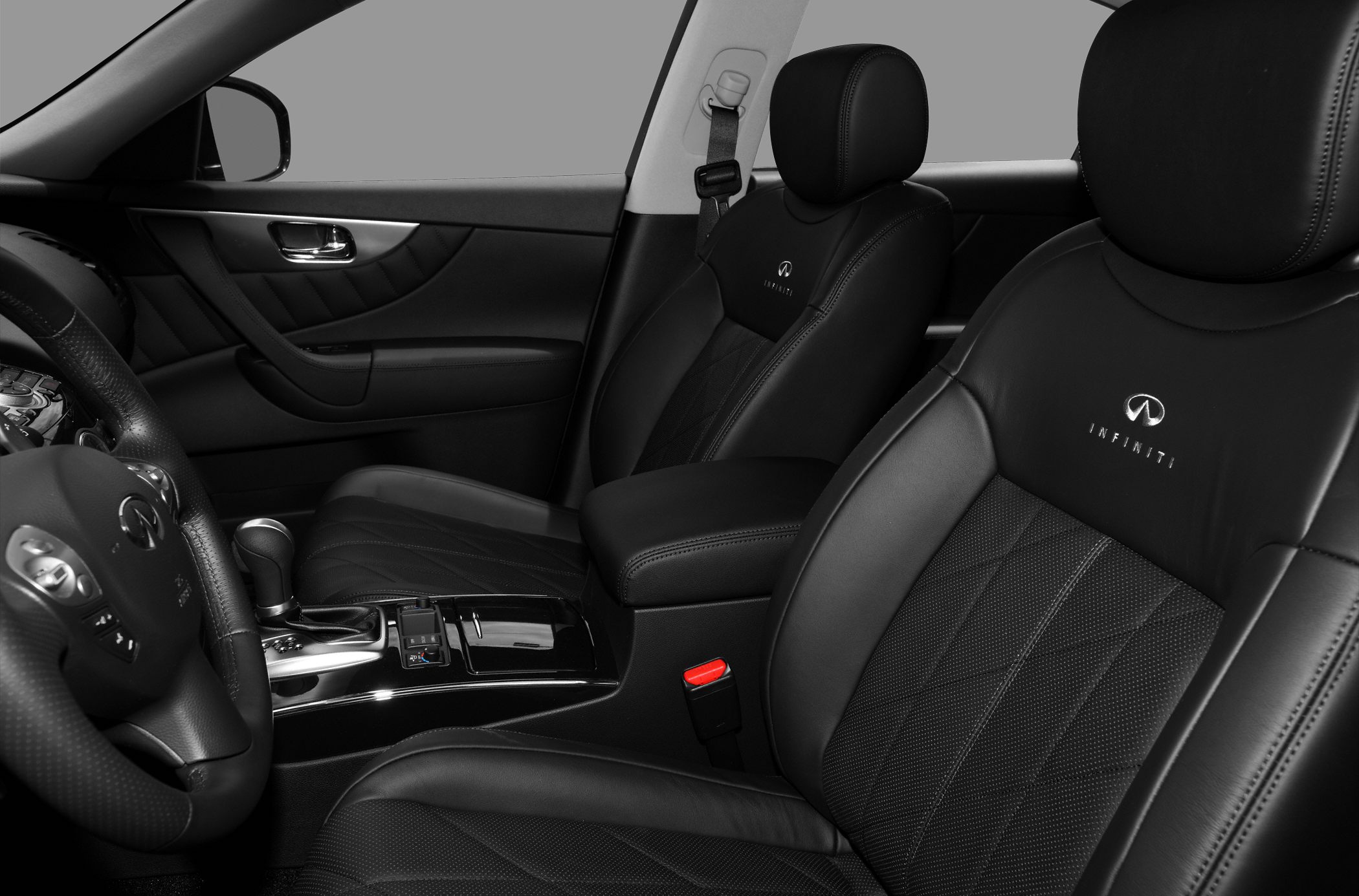 Black leather seats and luxury car interior with detailed upholstery and console.