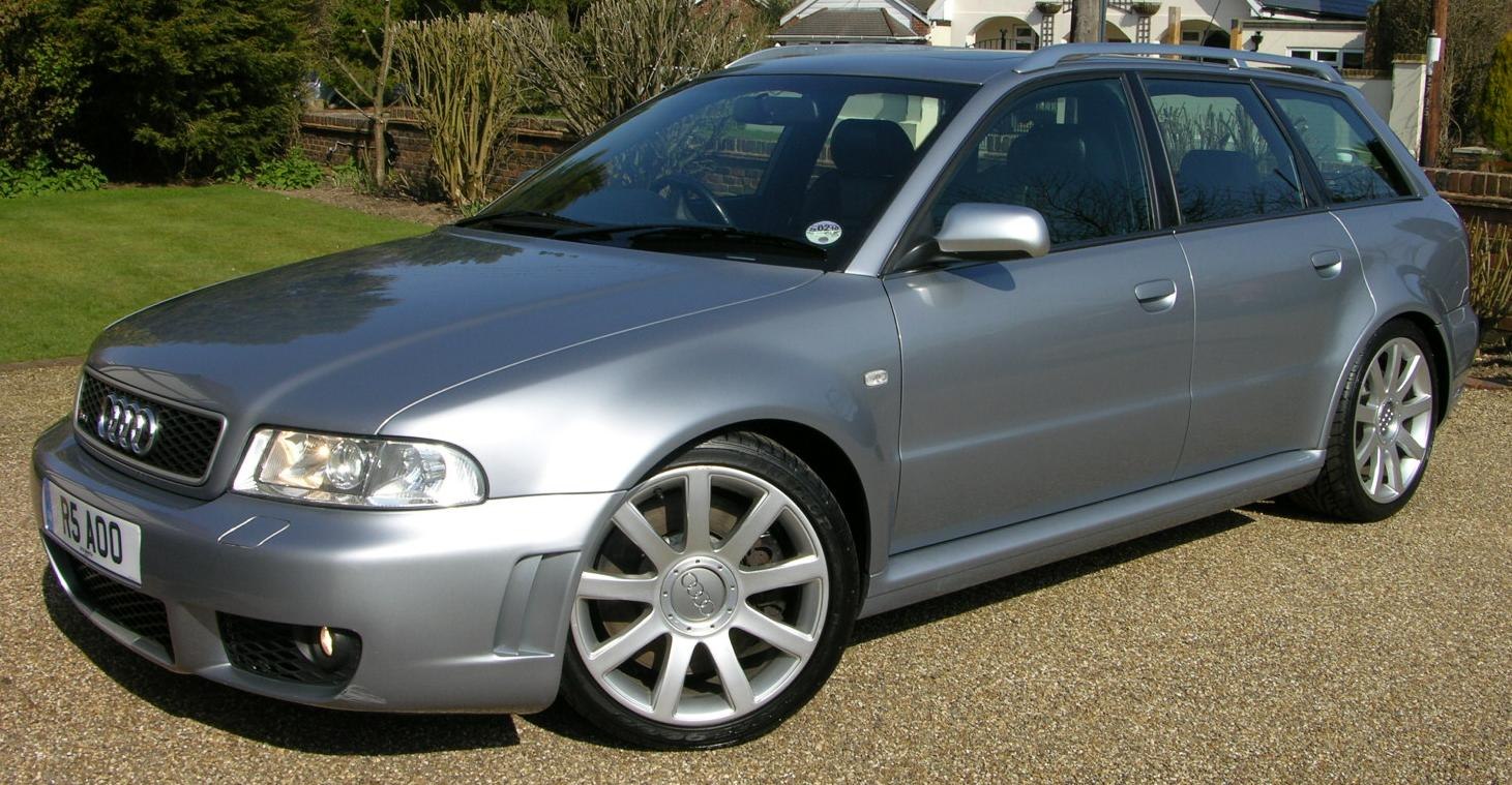 Silver station wagon with front-side view showing alloy wheels and roof rails