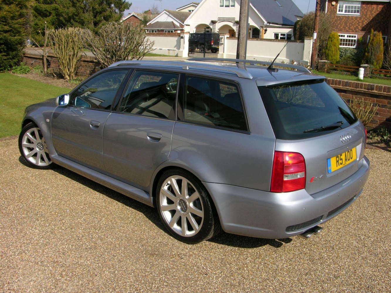 Rear and side view of a sporty estate with alloy wheels and roof rails