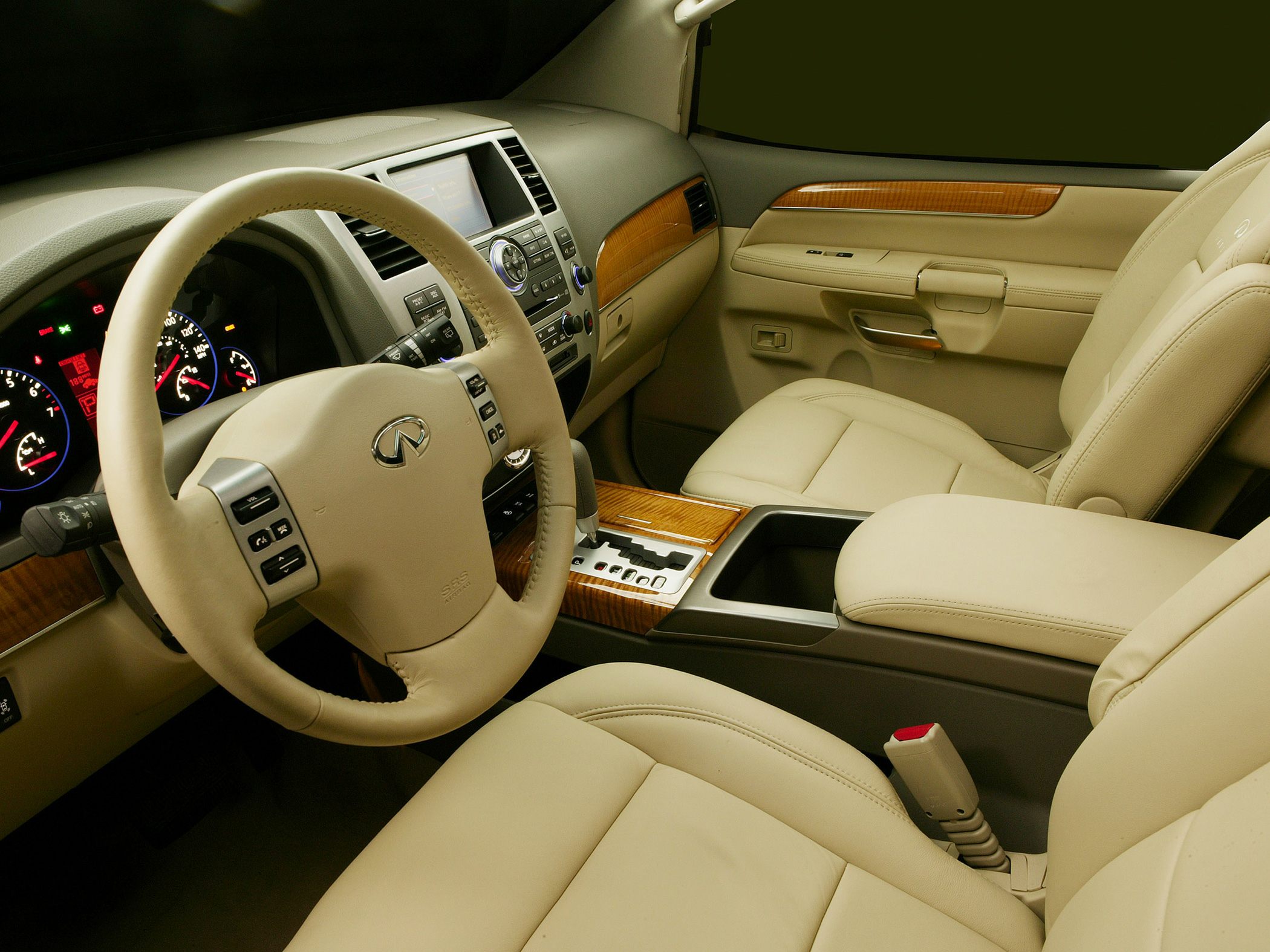 Beige leather interior with wooden trim and multifunction steering wheel