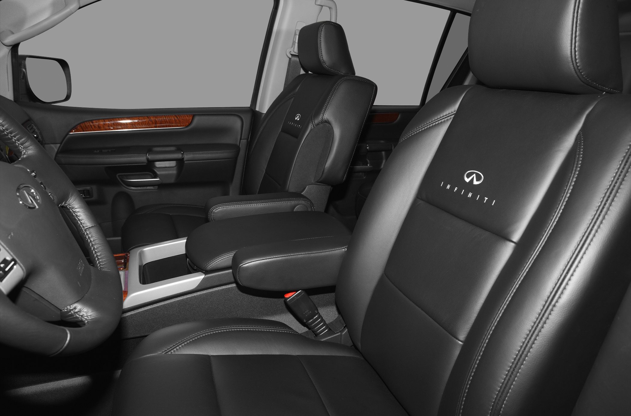 Premium black leather front seats with Infiniti logo and wood trim