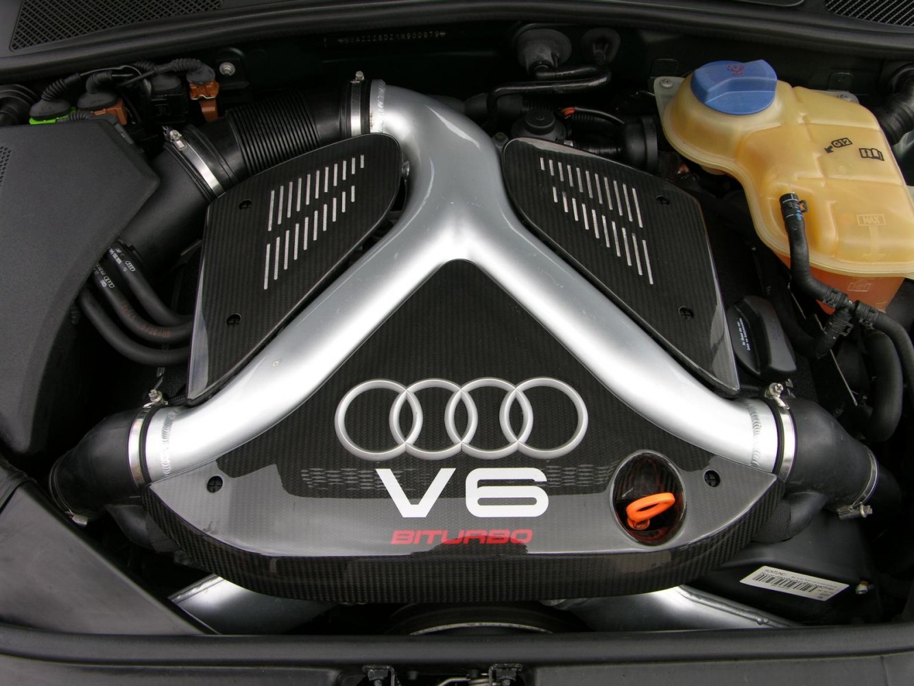 V6 biturbo engine cover with Audi rings and air intake pipes