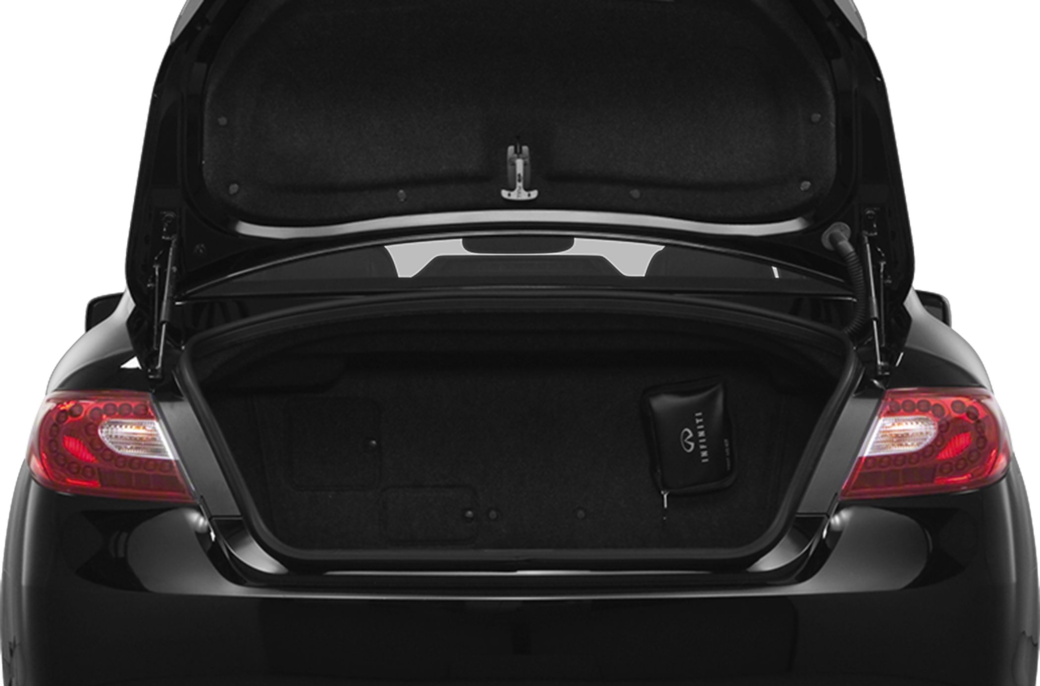 Open car trunk and illuminated rear taillights in black luxury sedan.
