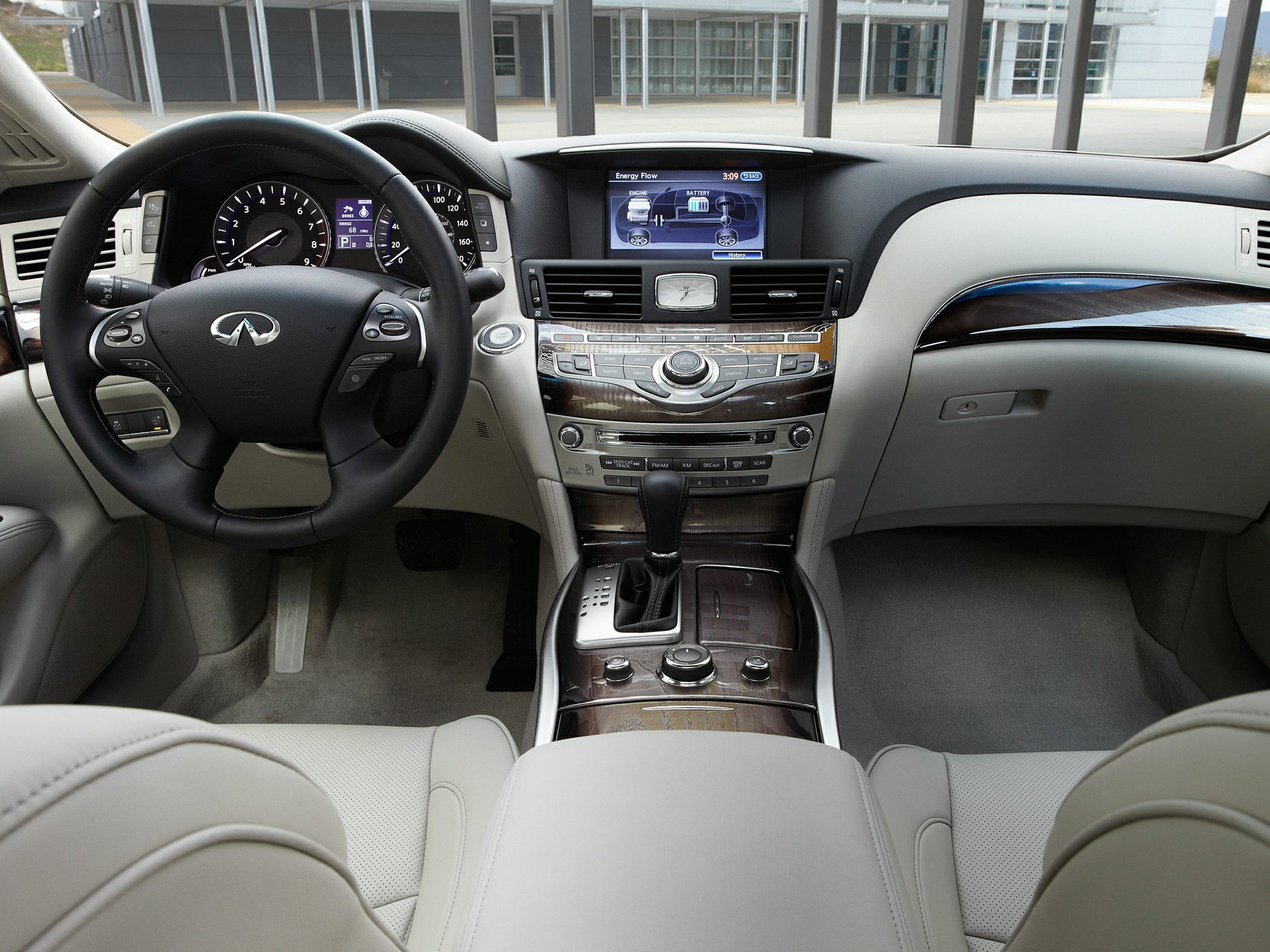 Luxury interior with dashboard, steering wheel, and infotainment controls