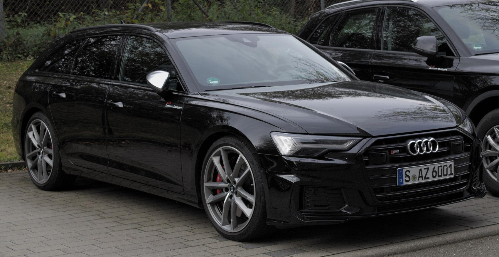 Black sporty station wagon with aggressive grille and alloy wheels