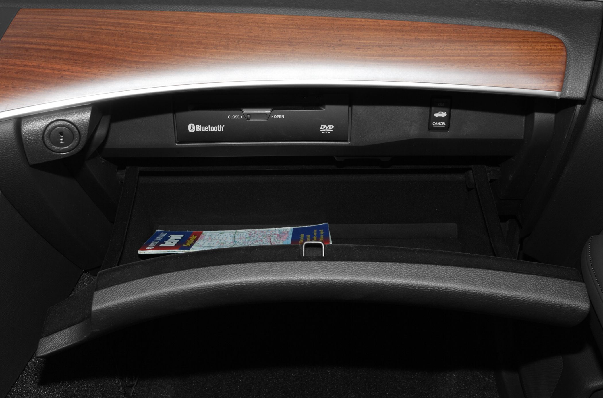 Glovebox interior with Bluetooth and DVD compartment, wood trim