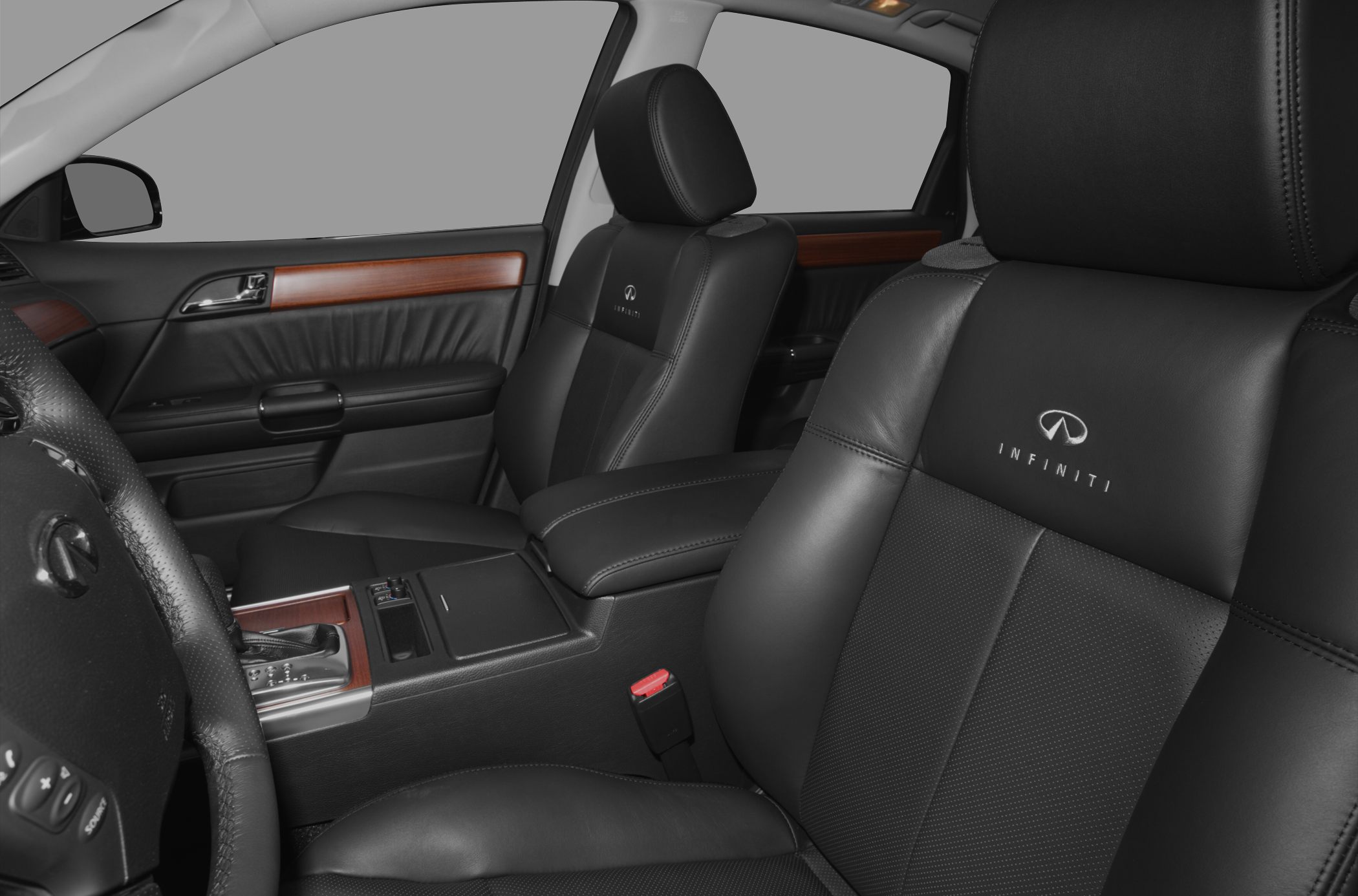 Black leather seats with Infiniti logo and wood trim interior