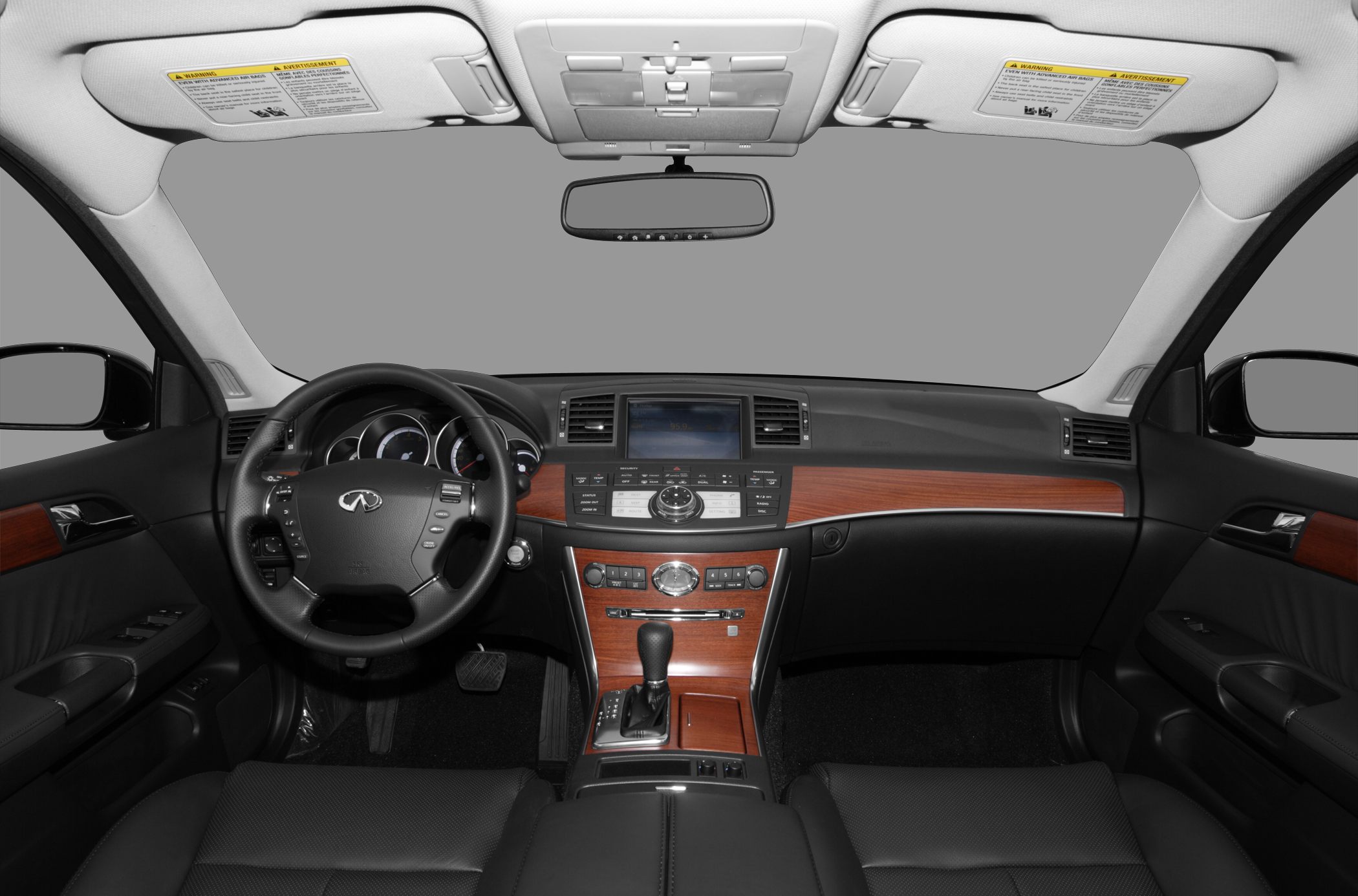 Luxury car interior with wood trim and advanced control panel