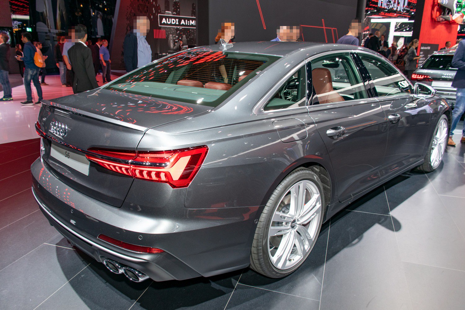 Rear view of a sedan with LED tail lights and quad exhaust