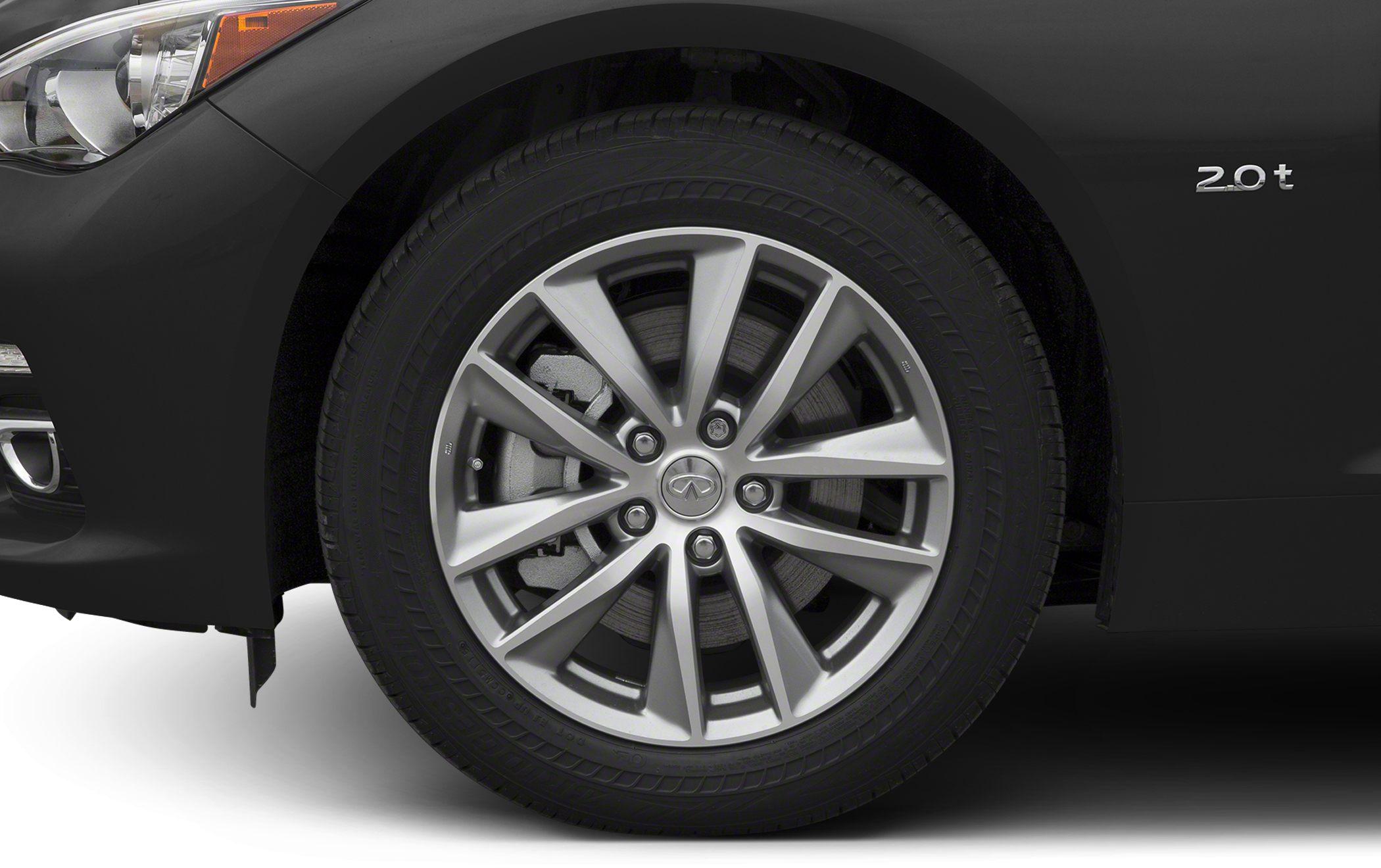 Front alloy wheel, brake caliper, headlight and 2.0t badge close-up