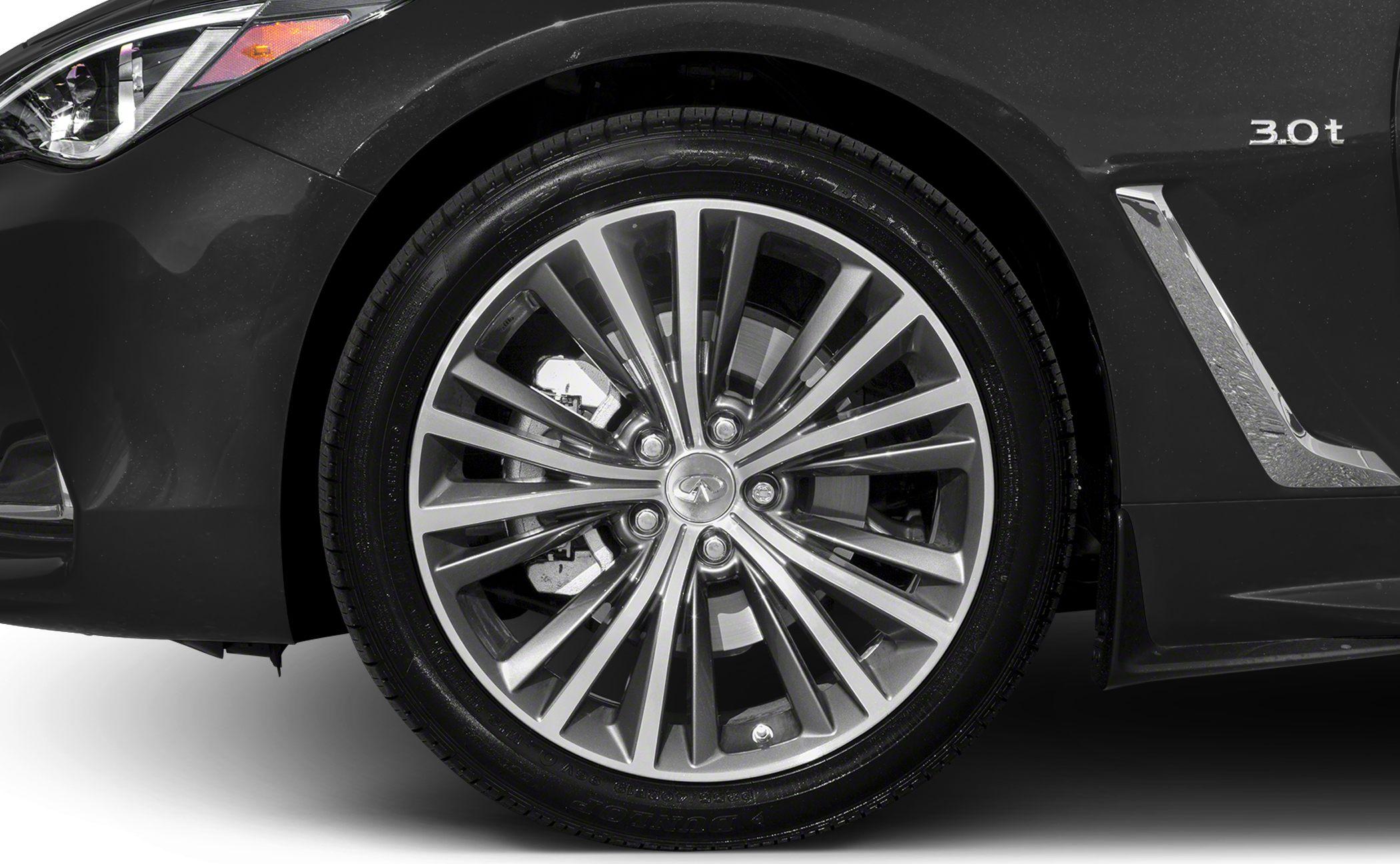 Close-up of front alloy wheel with multi-spoke design and 3.0t badge