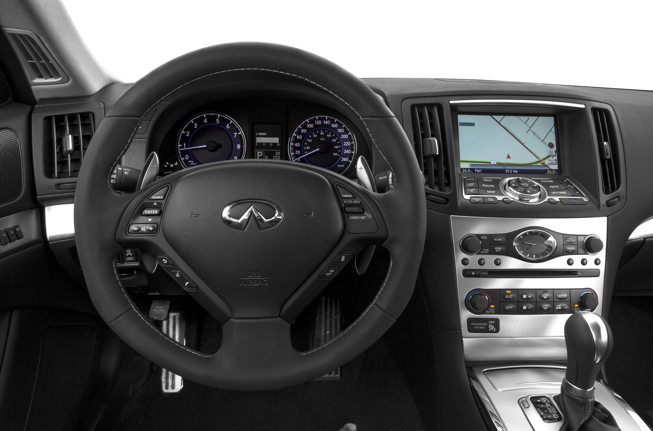Steering wheel with controls and dashboard with navigation screen and instrument cluster