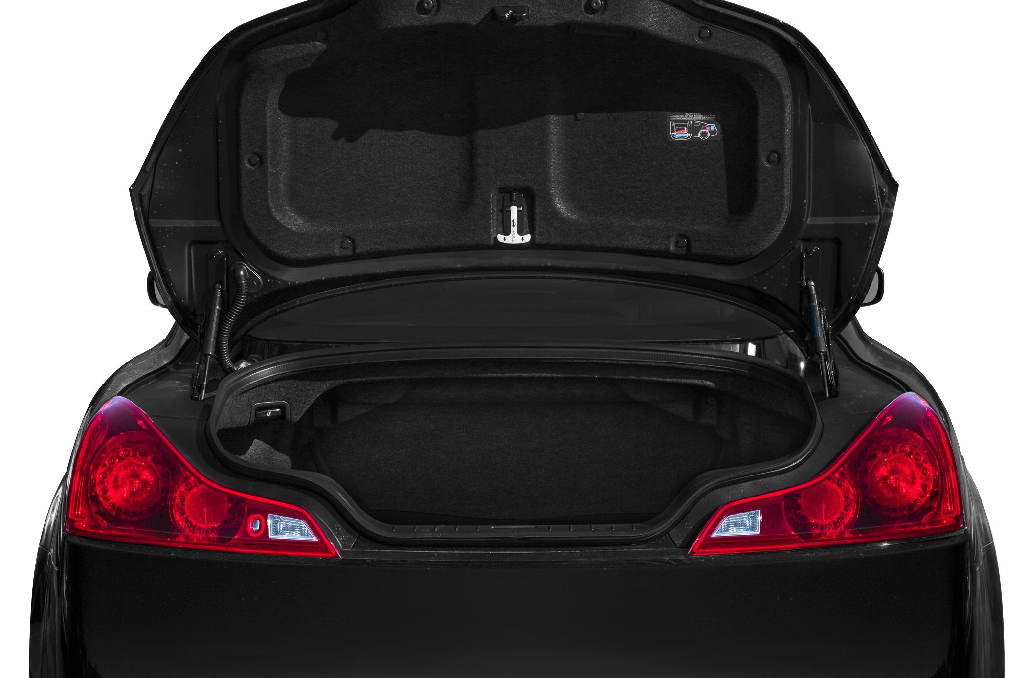 Open rear trunk with illuminated taillights in a sports coupe.