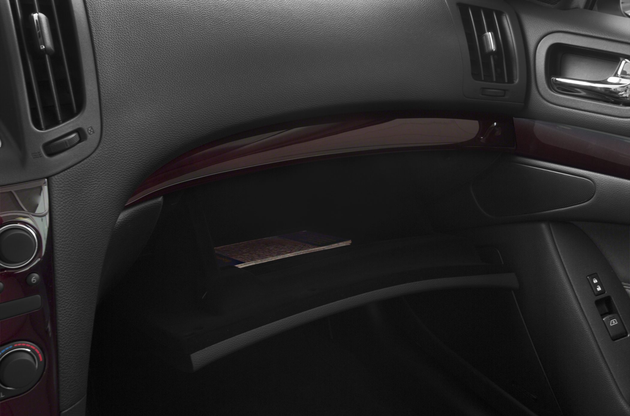 Glove compartment and dashboard air vents in luxury car interior