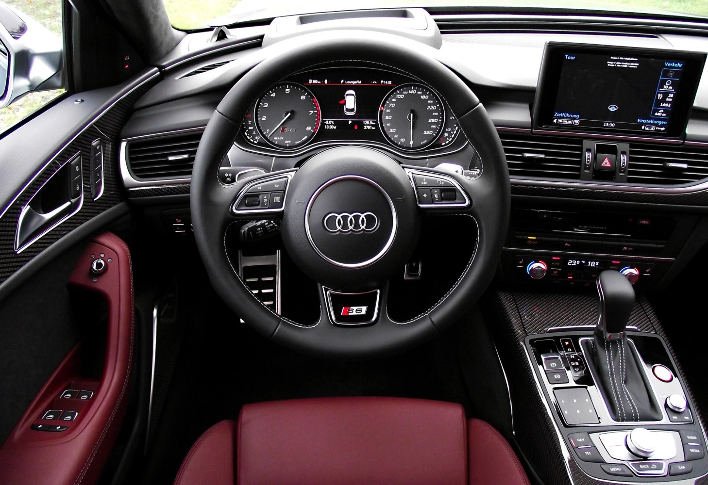 Sporty steering wheel and digital dashboard of luxury car interior