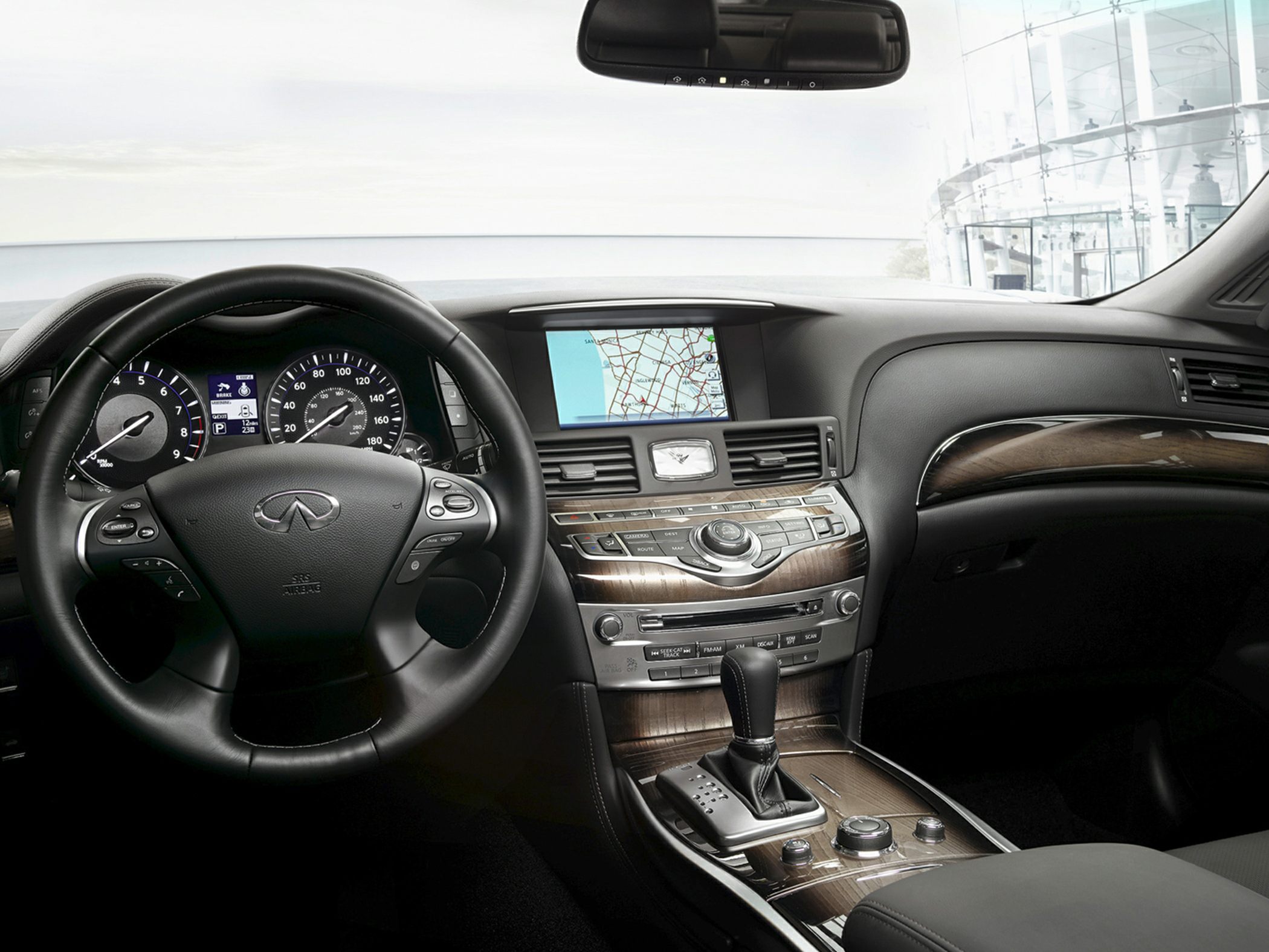 Dashboard with navigation screen and leather steering wheel