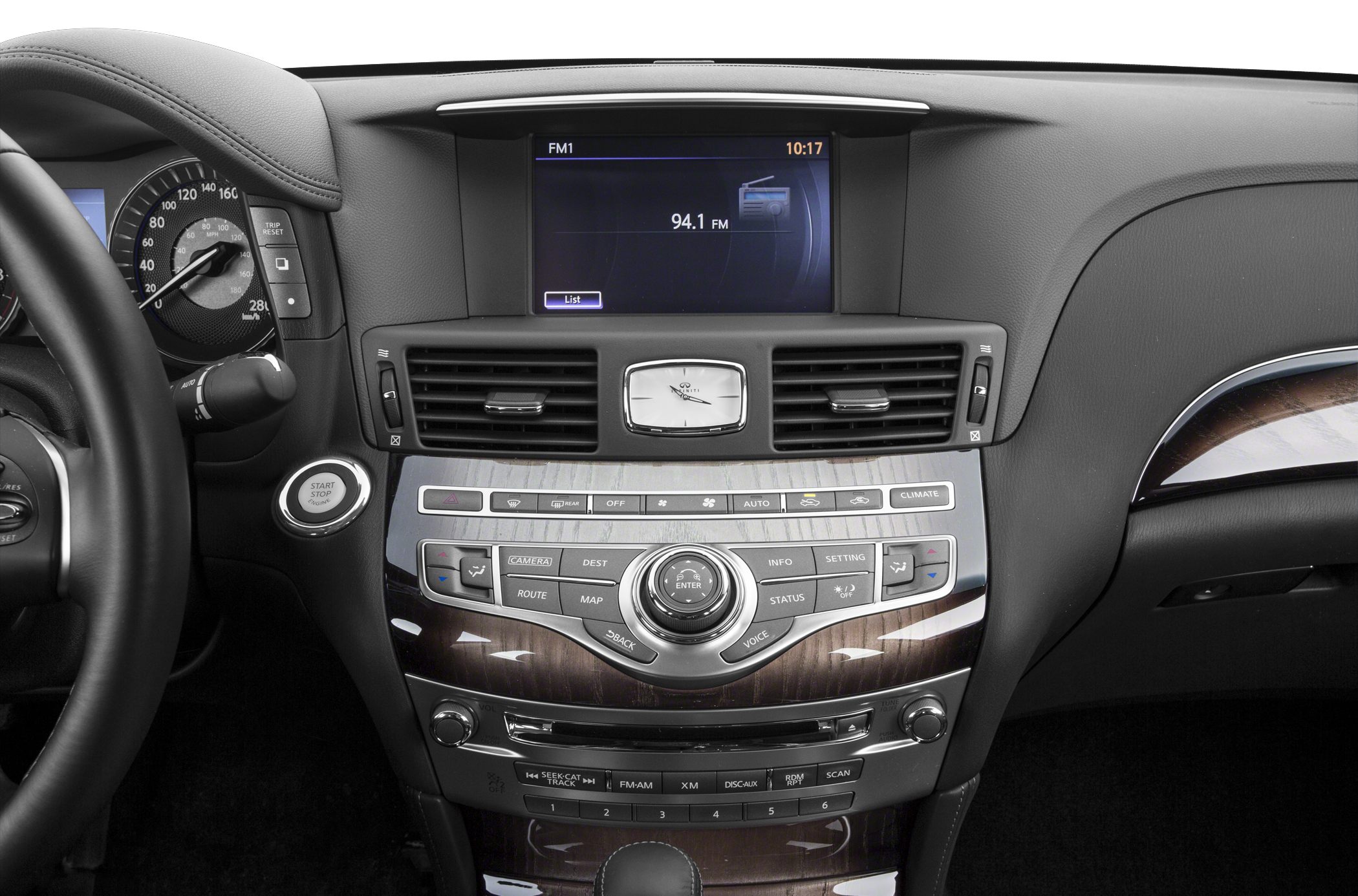 Dashboard with multimedia display, analog clock, and central controls