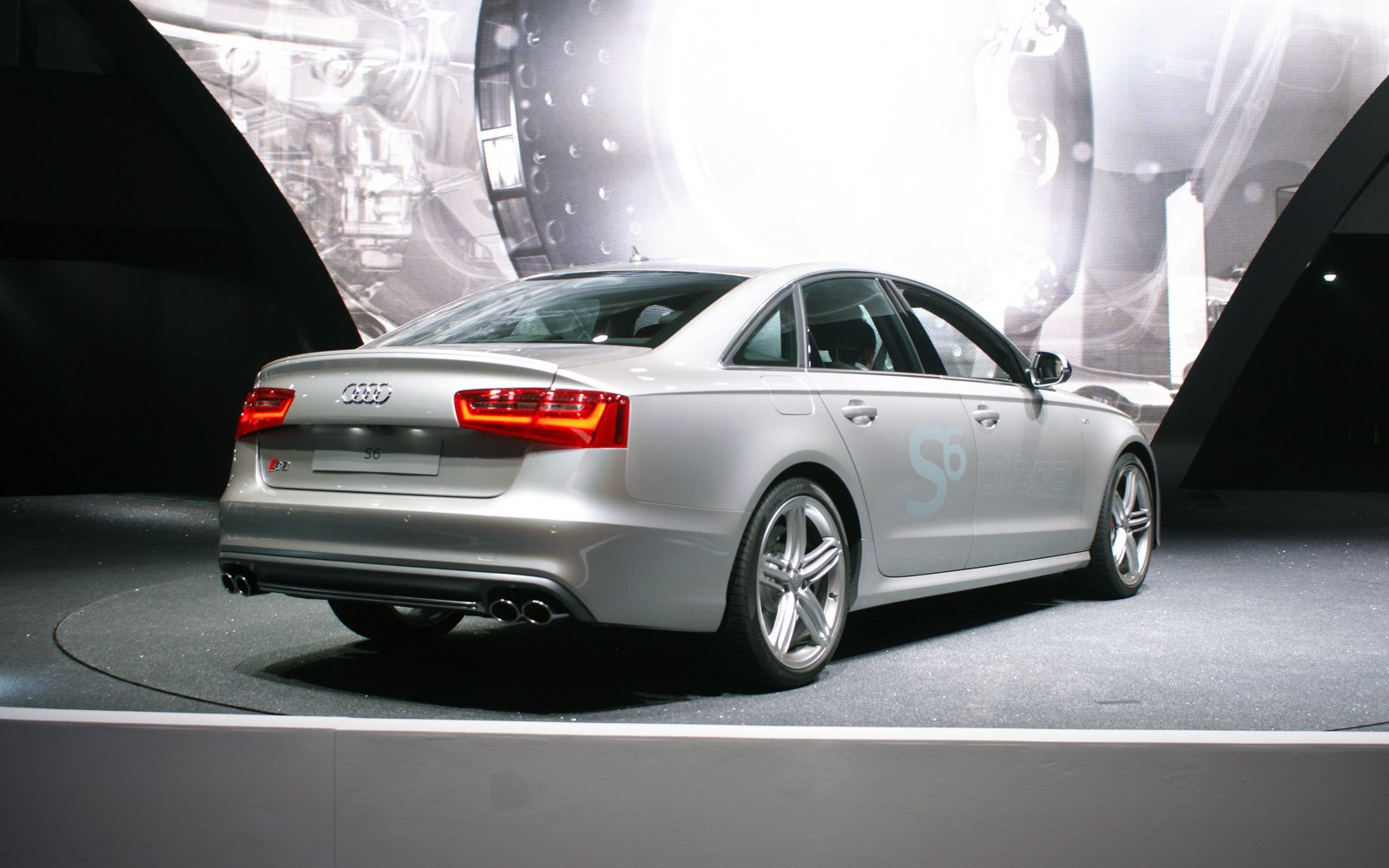 Rear and side profile with quad exhaust and alloy wheels