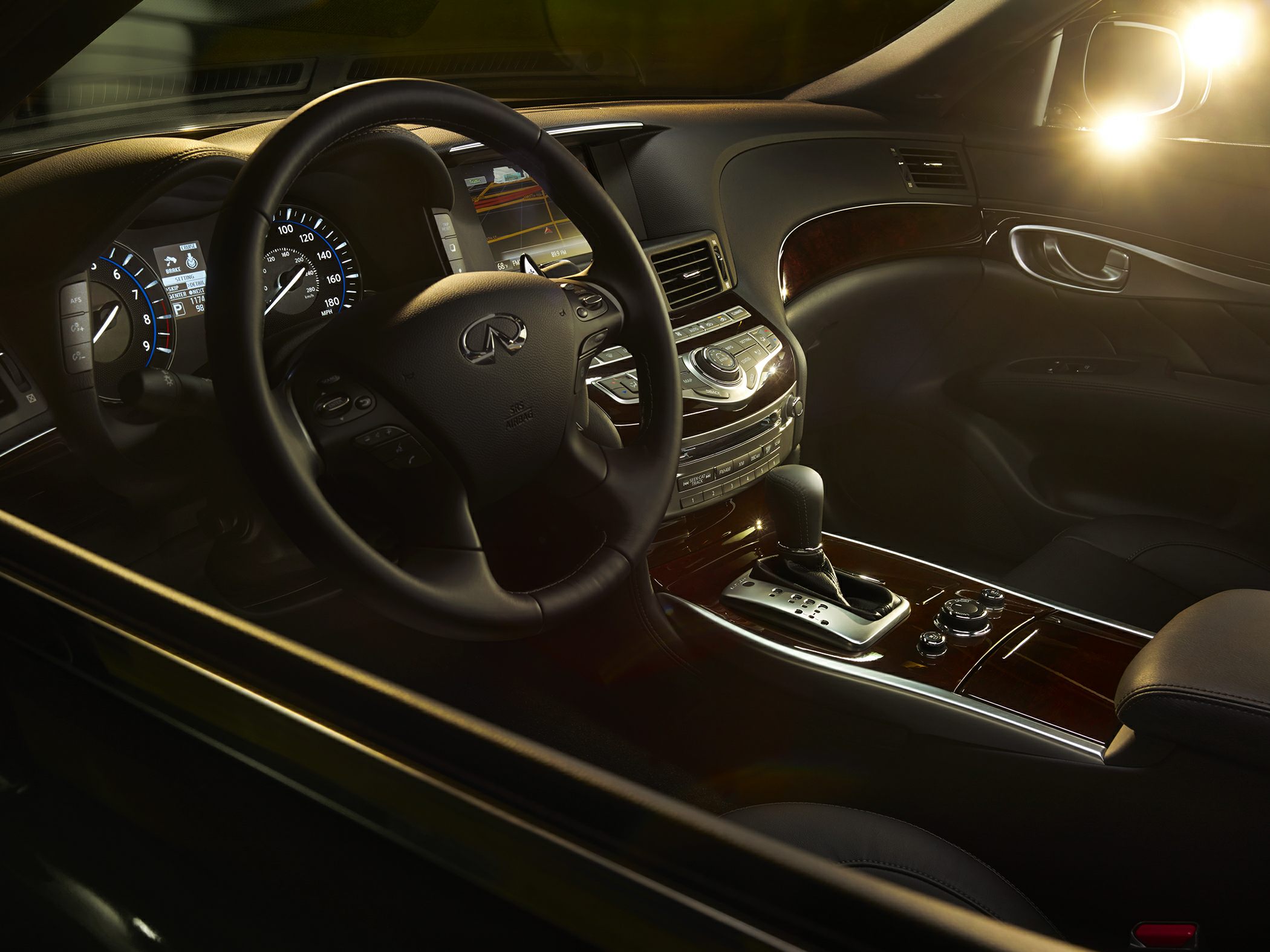 Luxurious dashboard and leather steering wheel with wood trim