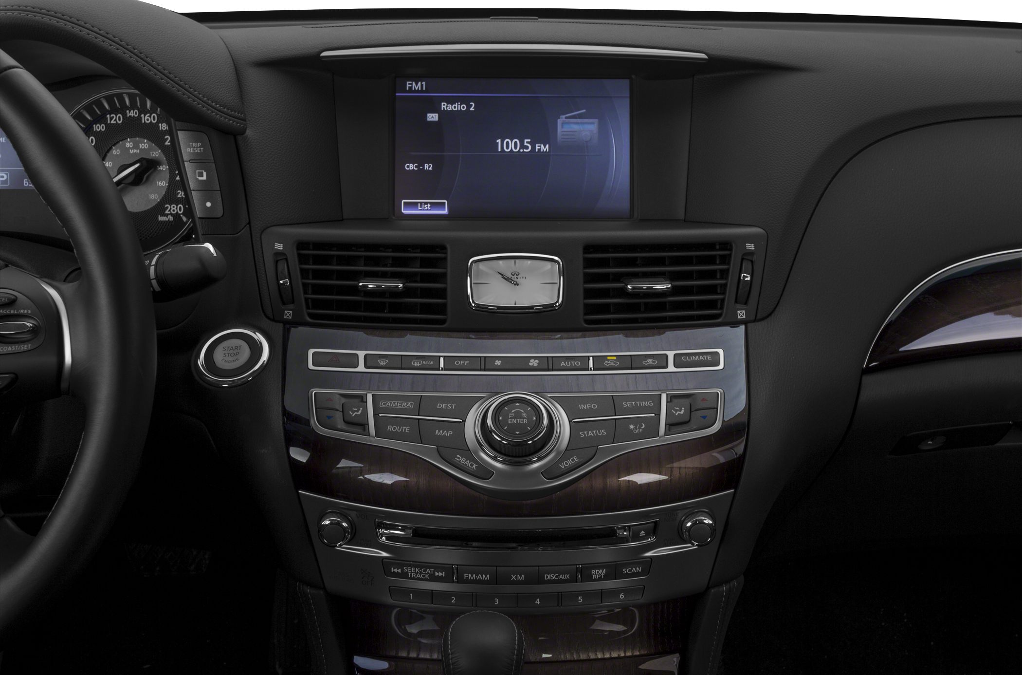 Car dashboard with multimedia display, analog clock, and control buttons