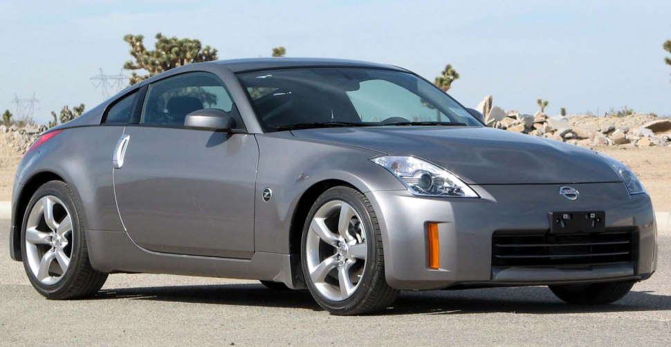 Metallic gray sporty coupe with sleek body and alloy wheels