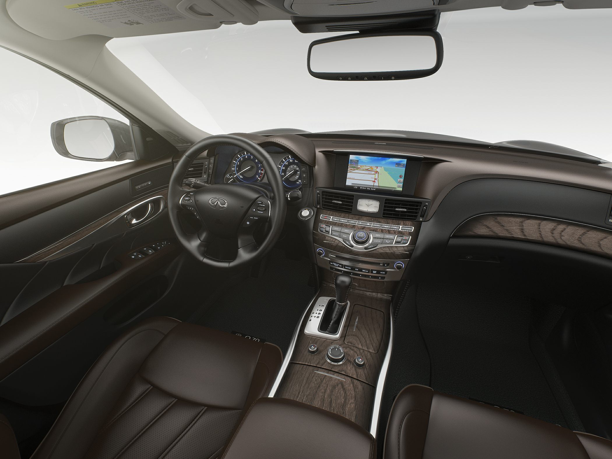 Luxury interior with leather seats and wood trim featuring navigation screen and digital dashboard.