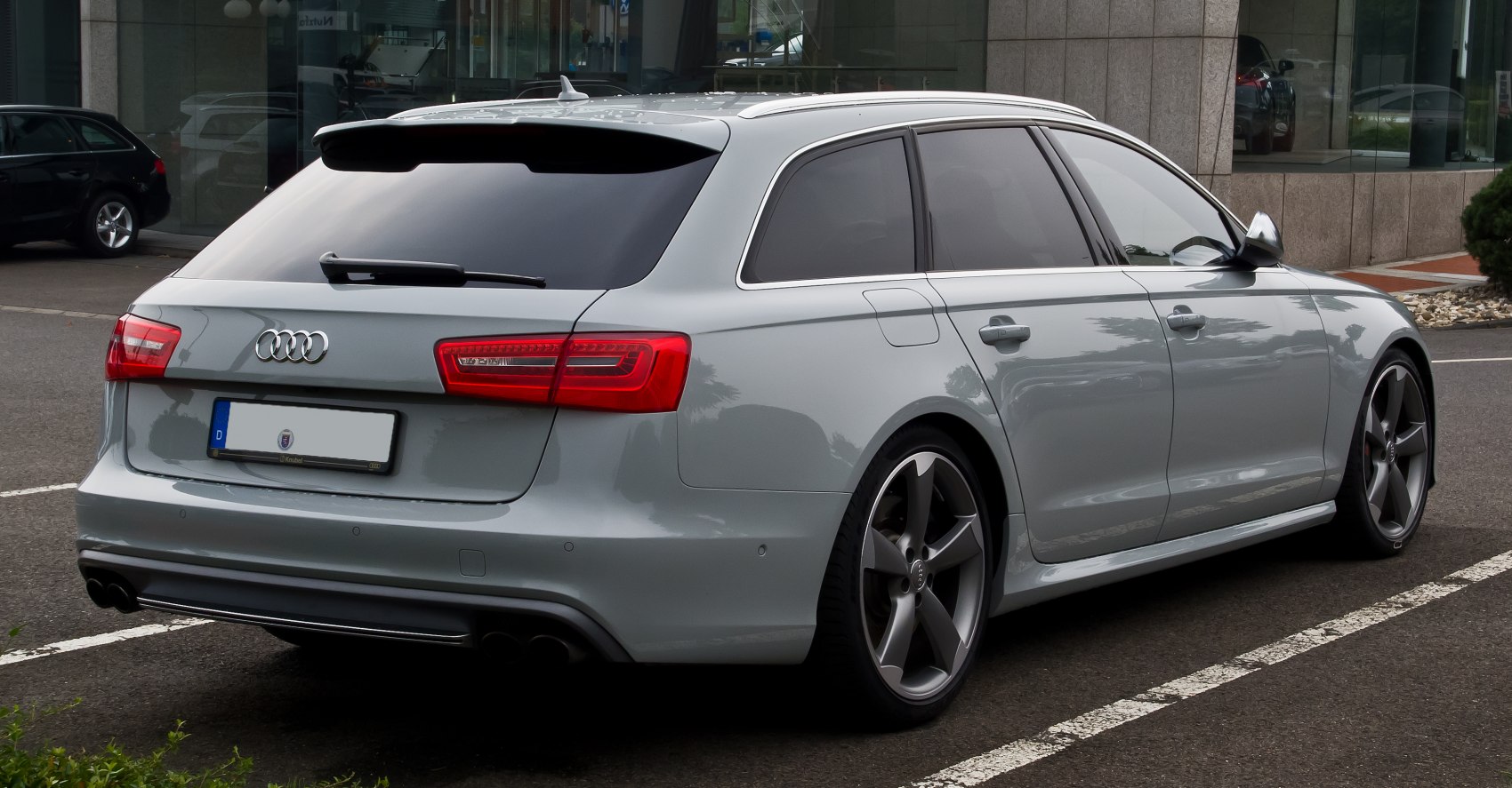 Rear view of sporty wagon with five-spoke alloy wheels and dual exhaust