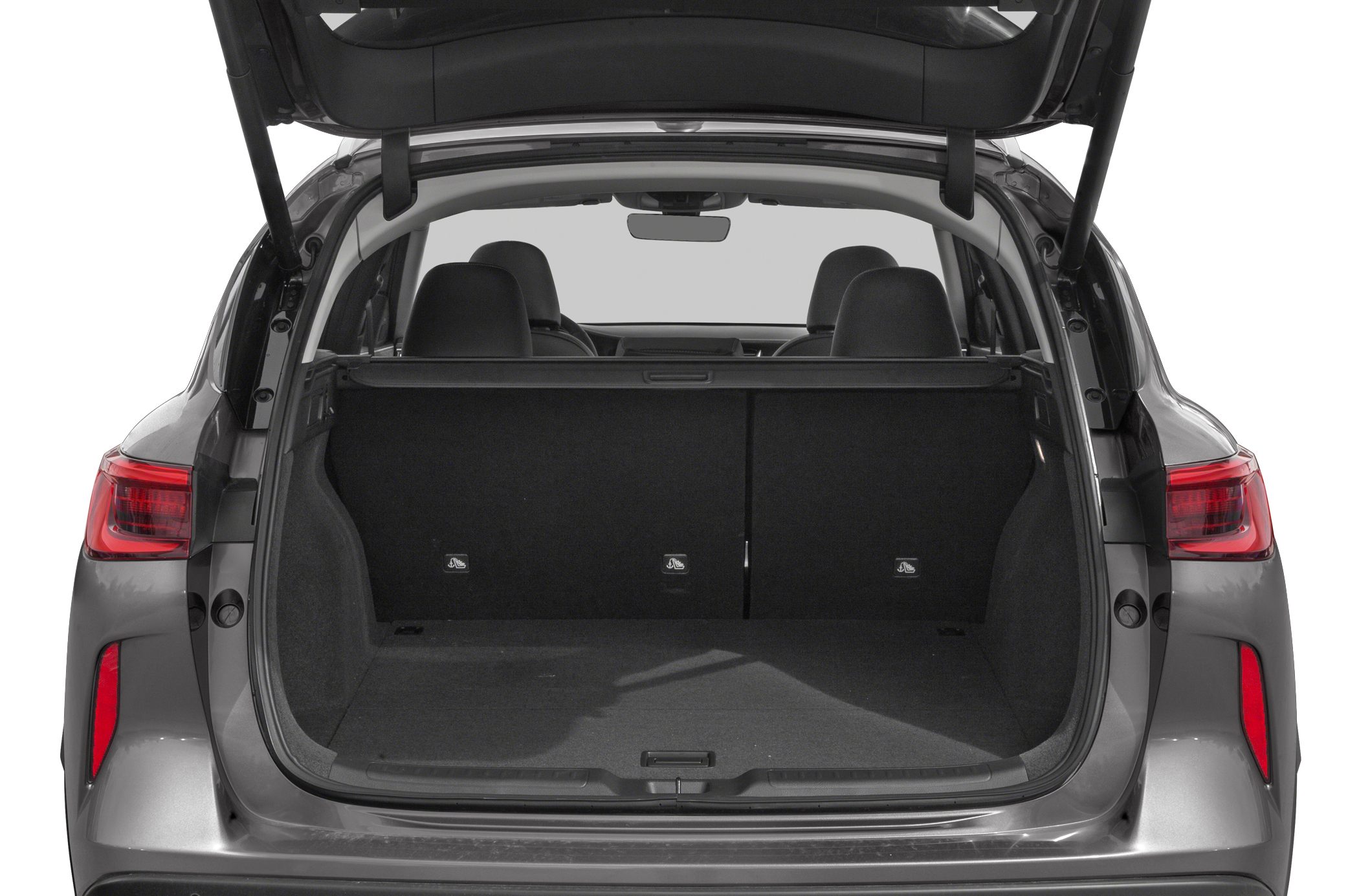 Spacious open trunk area with rear seats and cargo cover