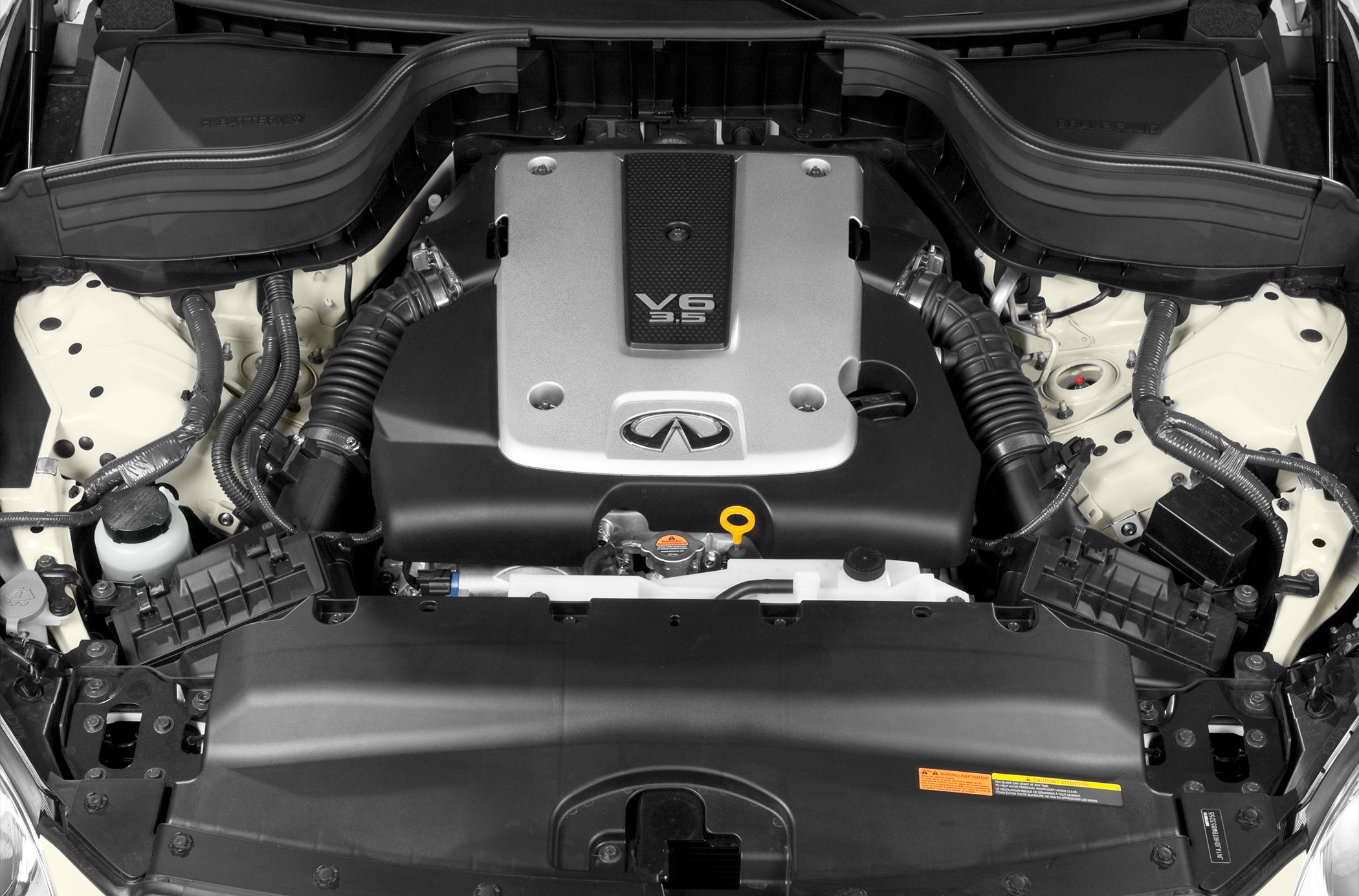 V6 3.5 engine bay with Infiniti emblem and detailed engine components
