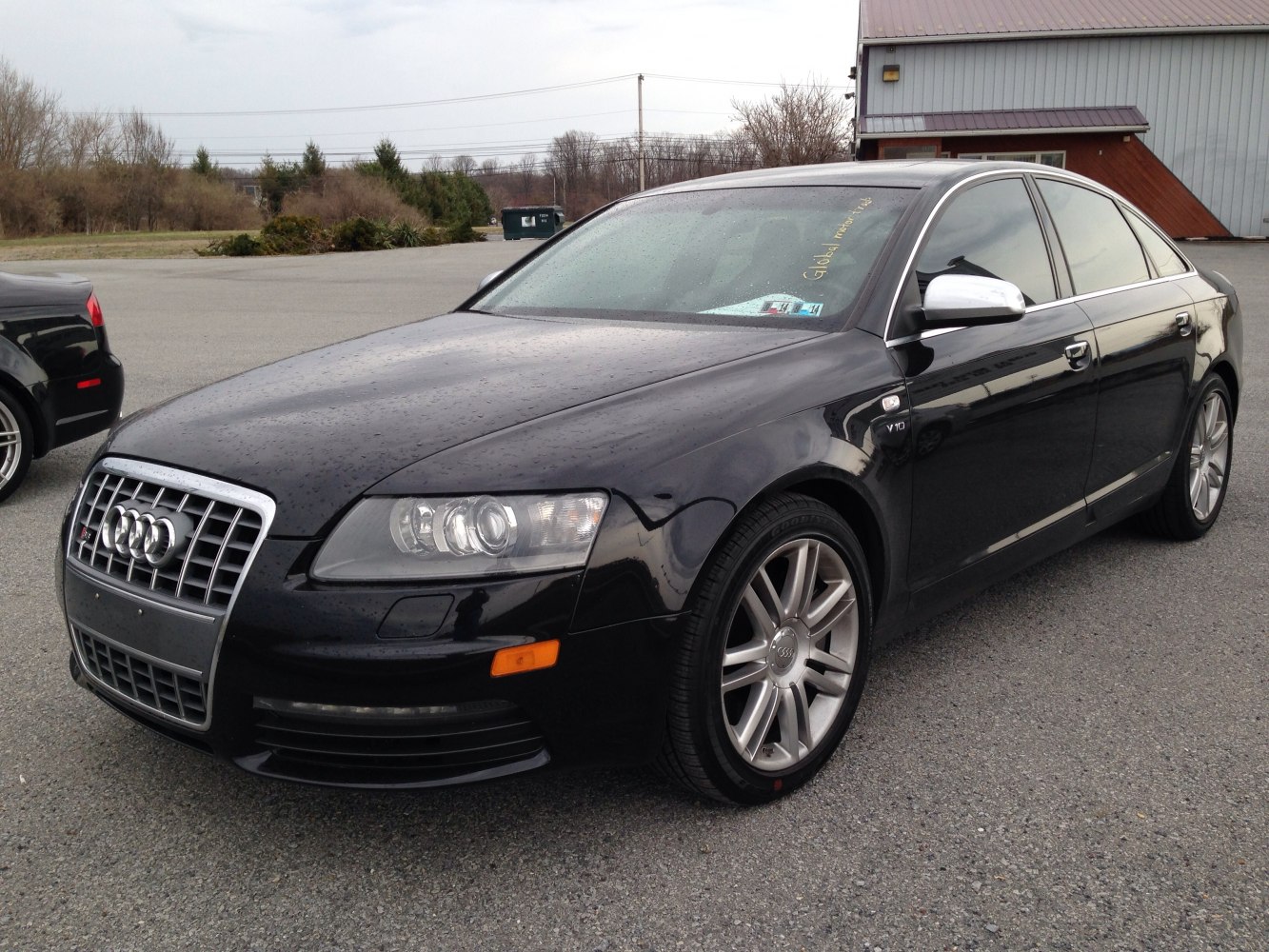 Front and side exterior with headlights and alloy wheels