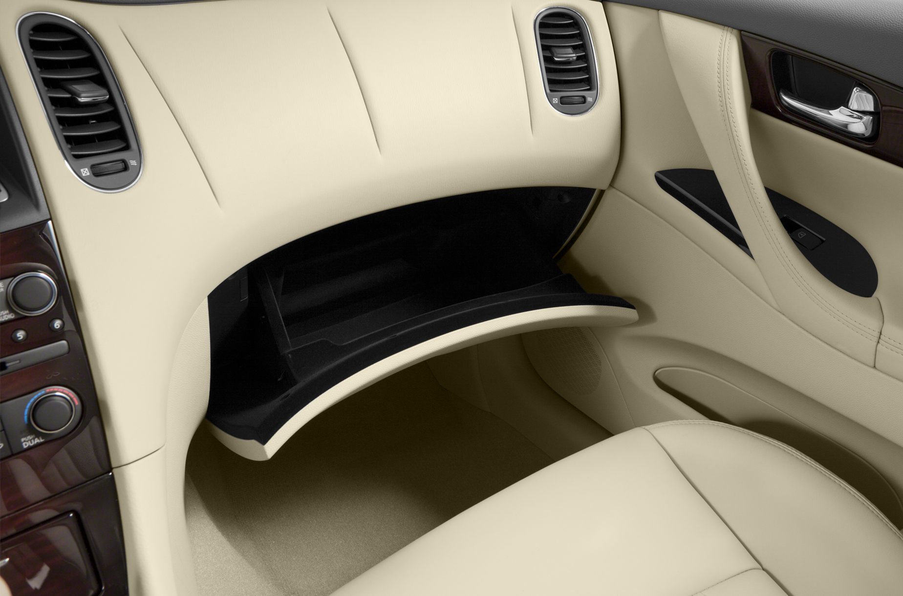 Open glovebox, dashboard air vents, beige leather interior.