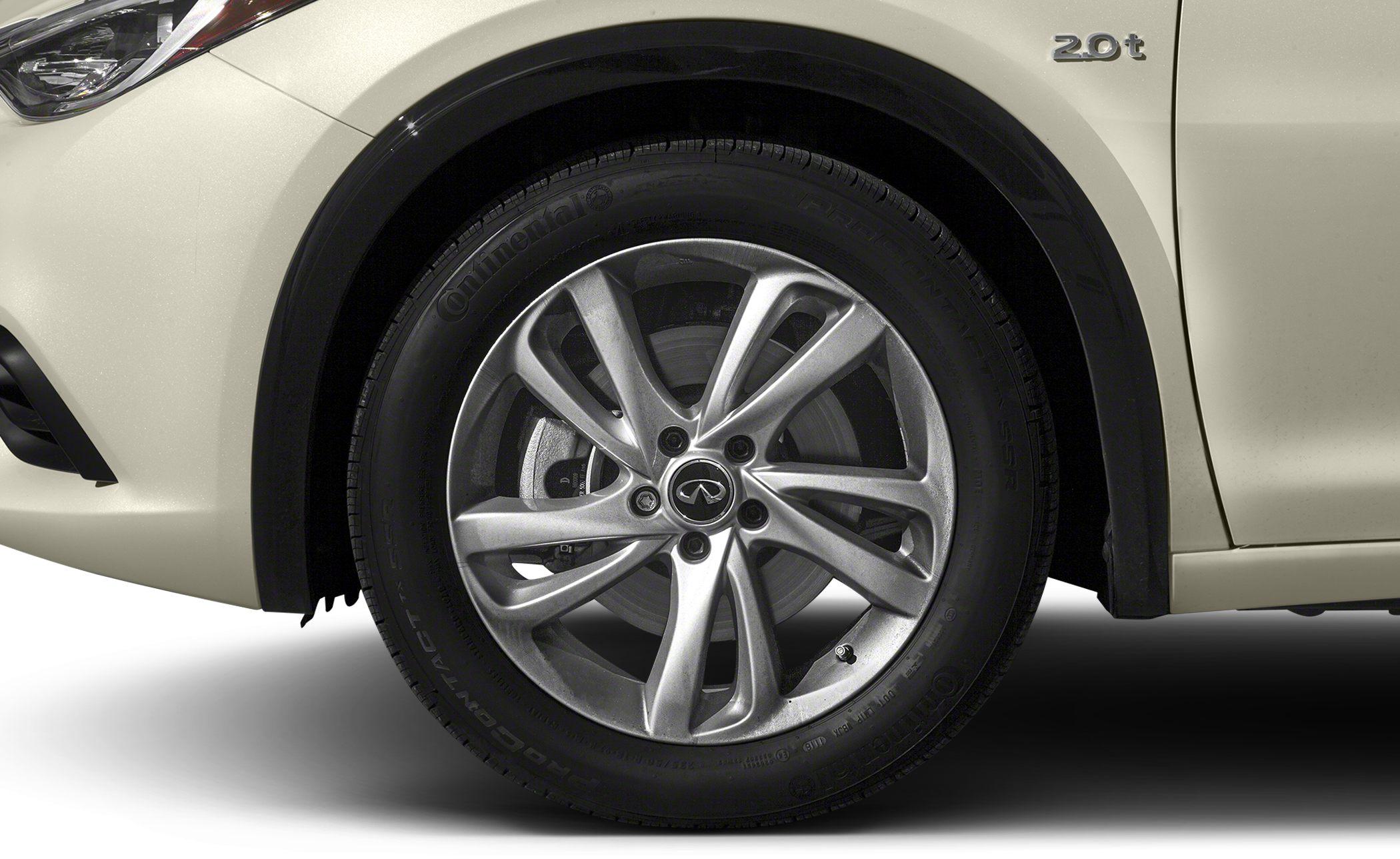 Alloy wheel and tire close-up with 2.0t badge
