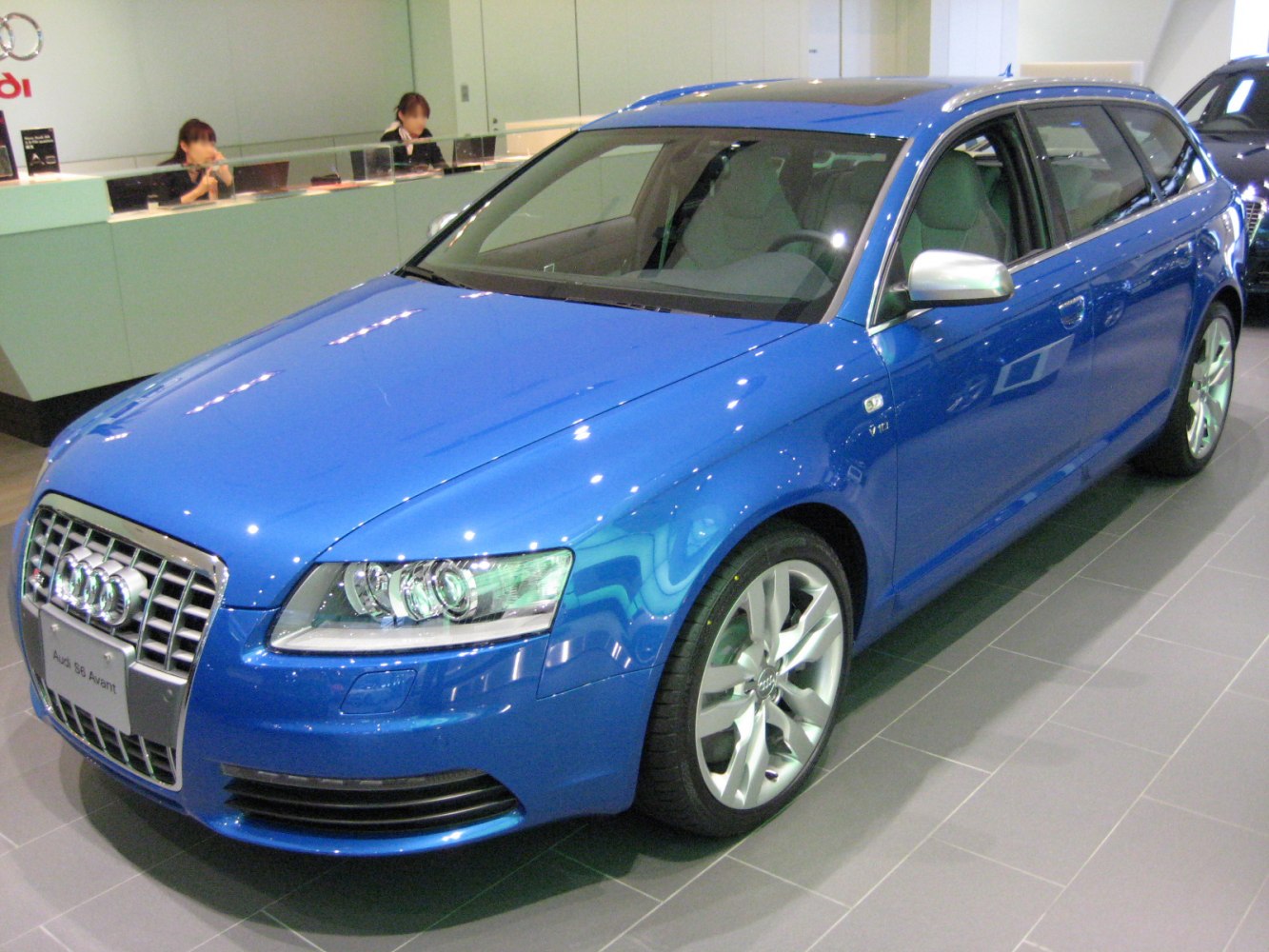 Blue sporty wagon with distinctive grille and alloy wheels