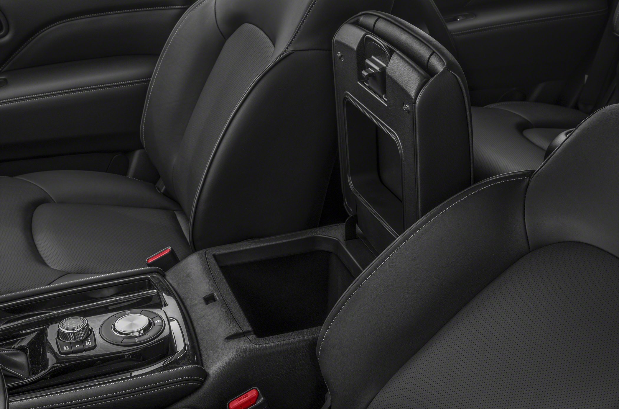 Leather seats with open center console storage and control dials
