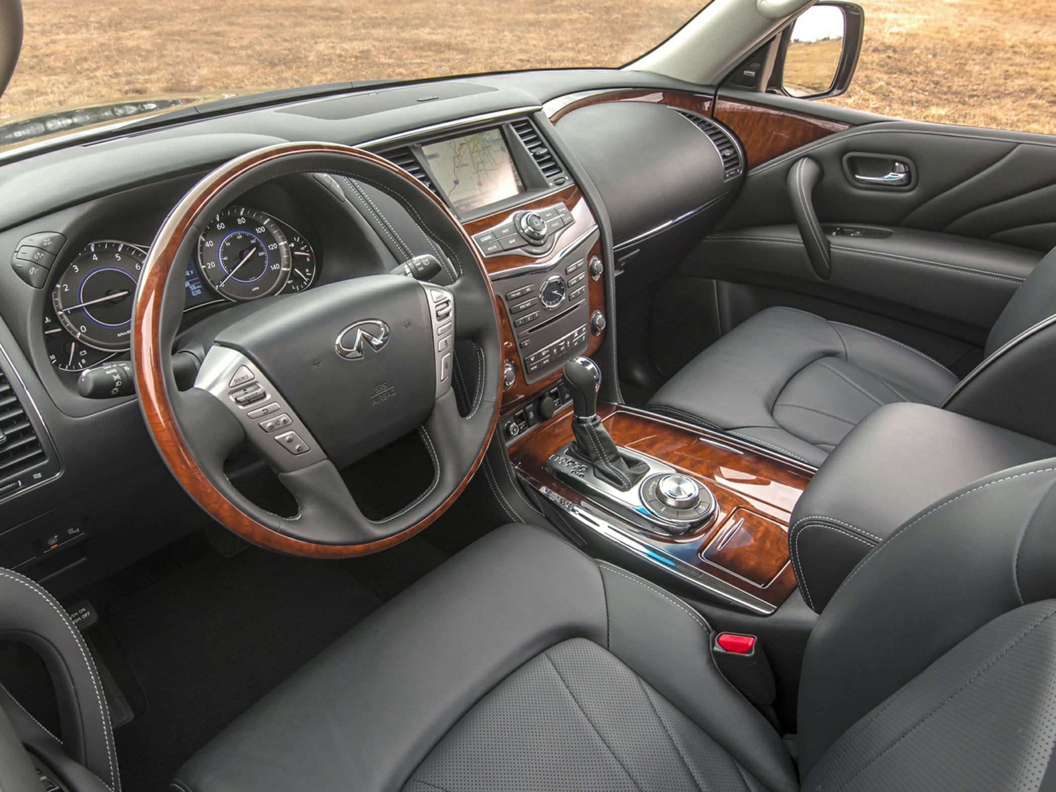 Luxury SUV interior with wood trim and leather seats